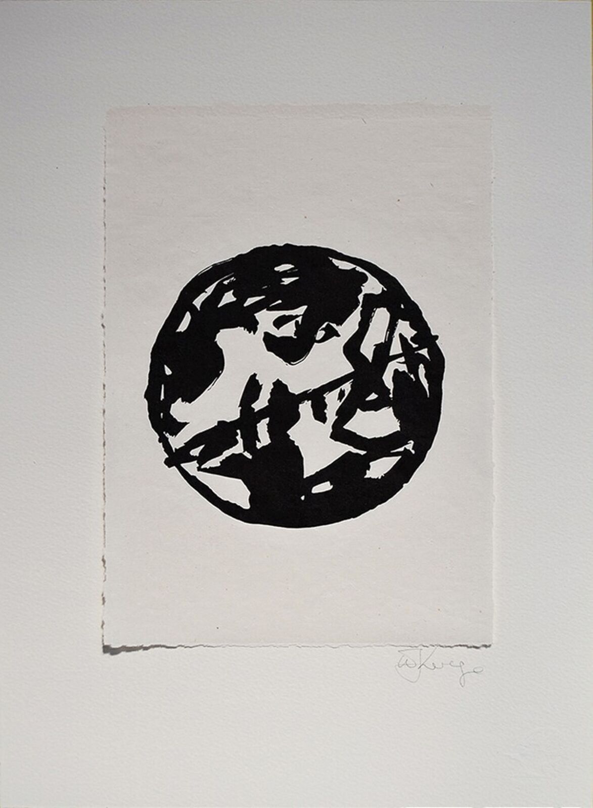 A black and white drawing of a circle on a piece of paper.