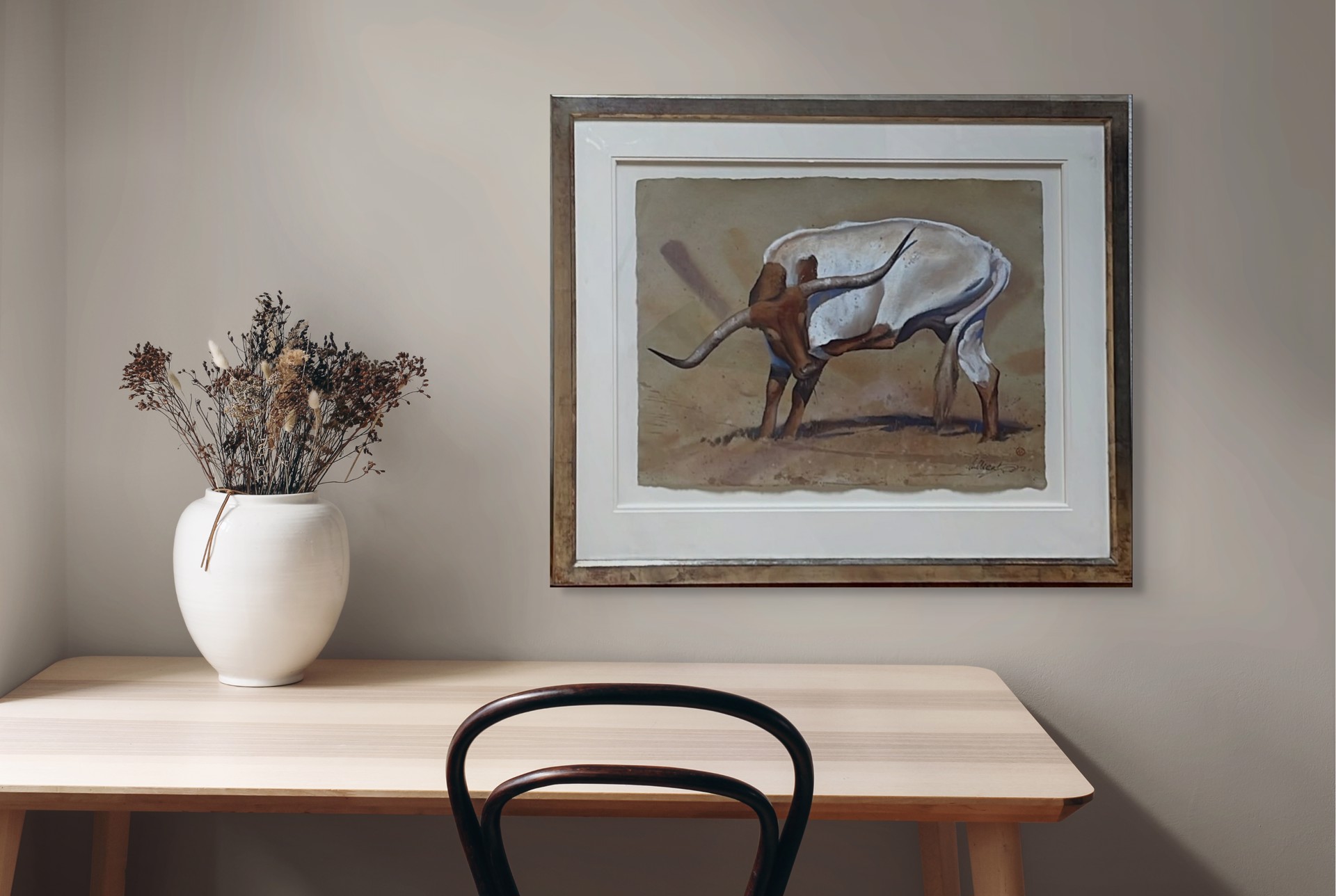 A stylized painting of a white bull with long curved horns standing in a desert landscape.