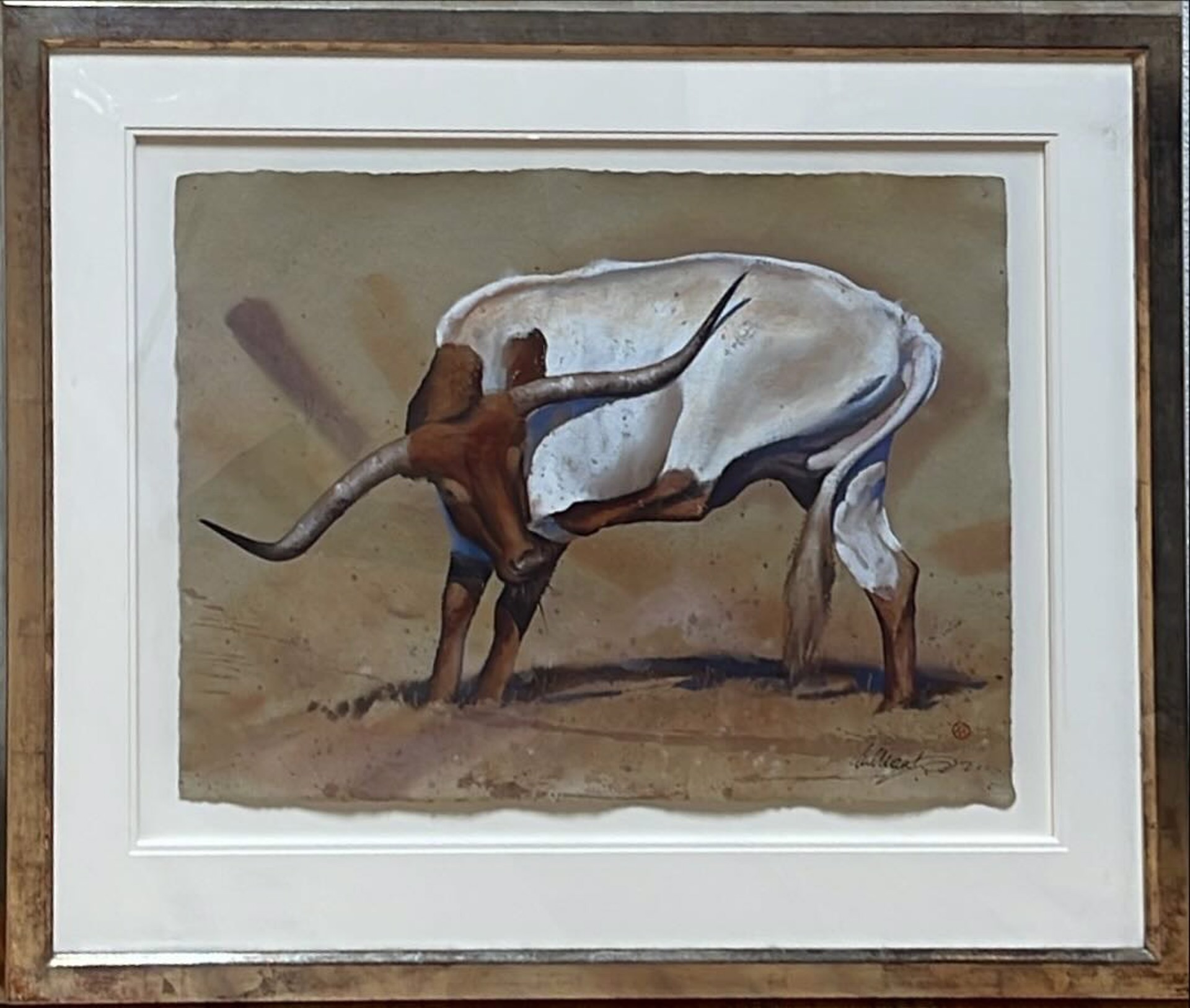 A stylized painting of a white bull with long curved horns standing in a desert landscape.