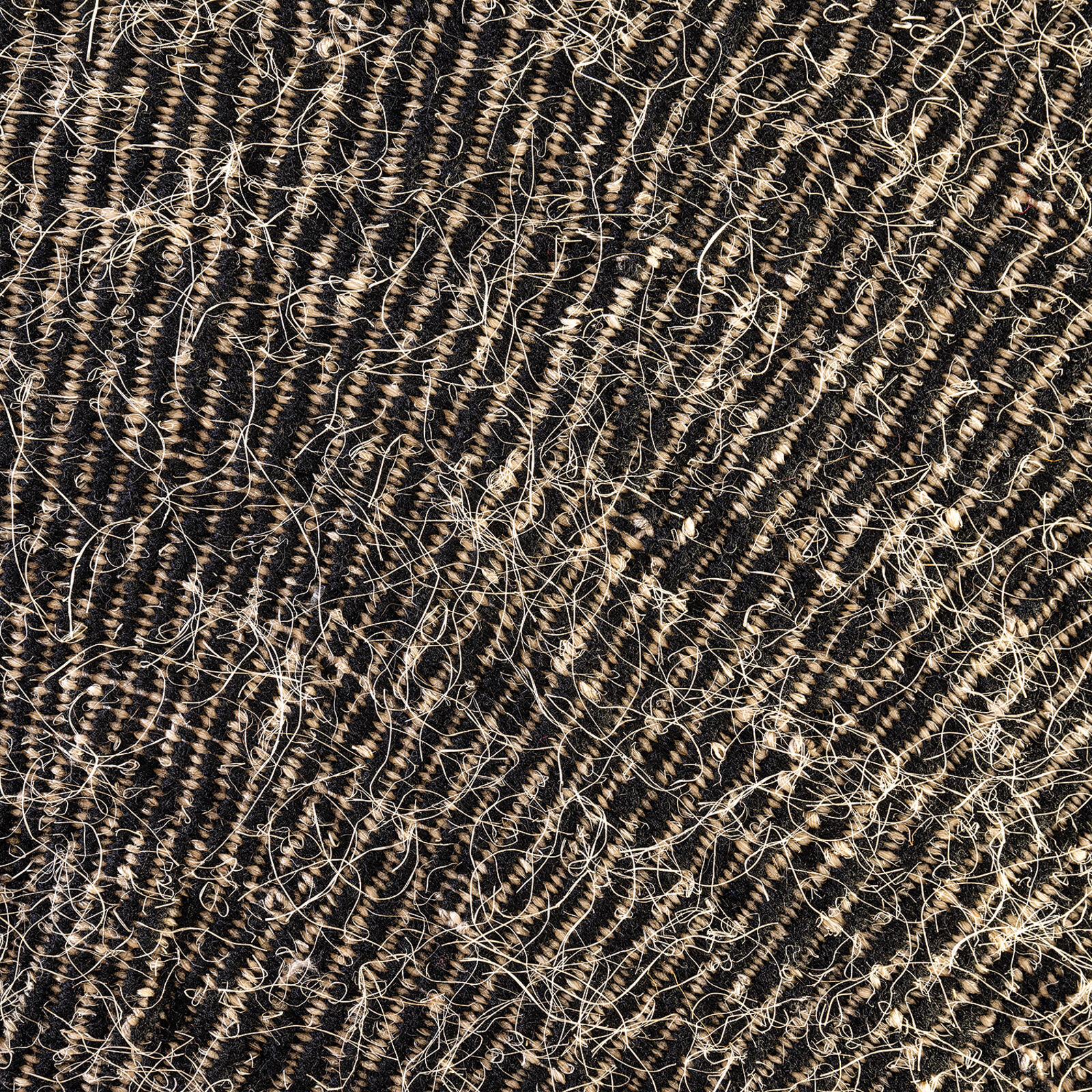 A minimalist textile artwork featuring a sunburst pattern emerging from a horizontal horizon line.