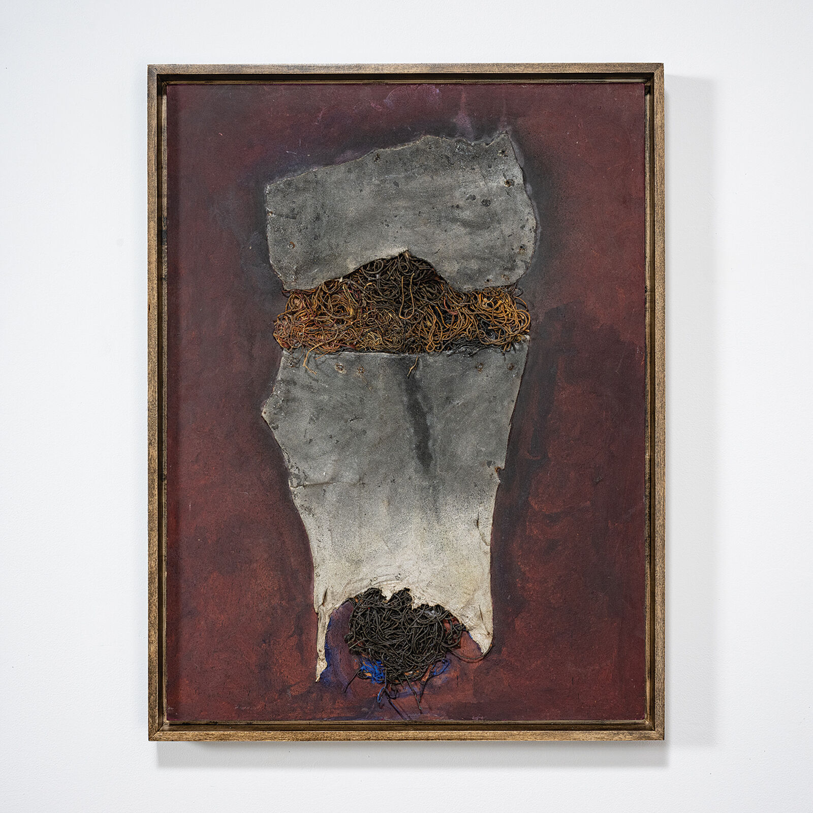 A painting hanging on a wall in a room.