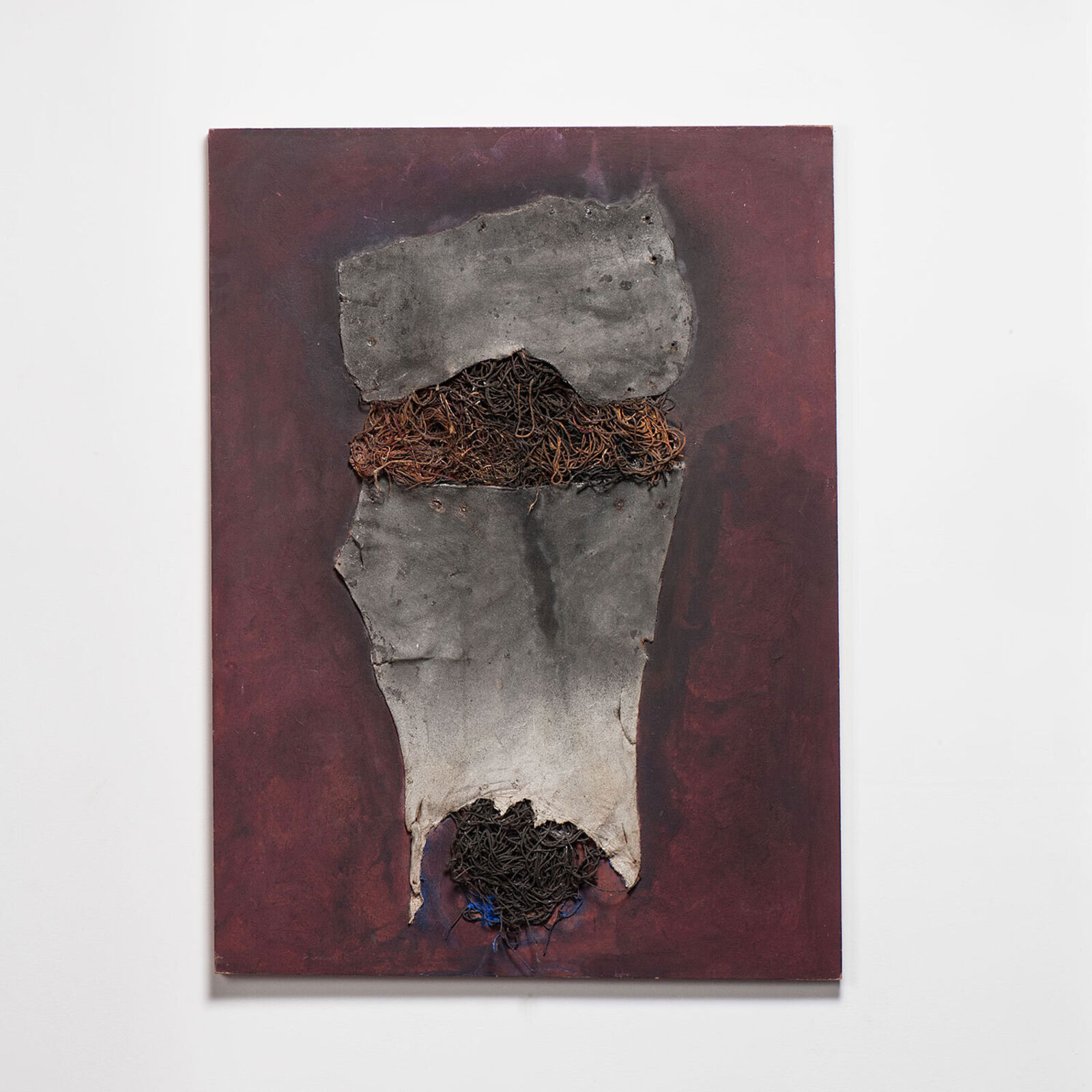 A painting hanging on a wall in a room.