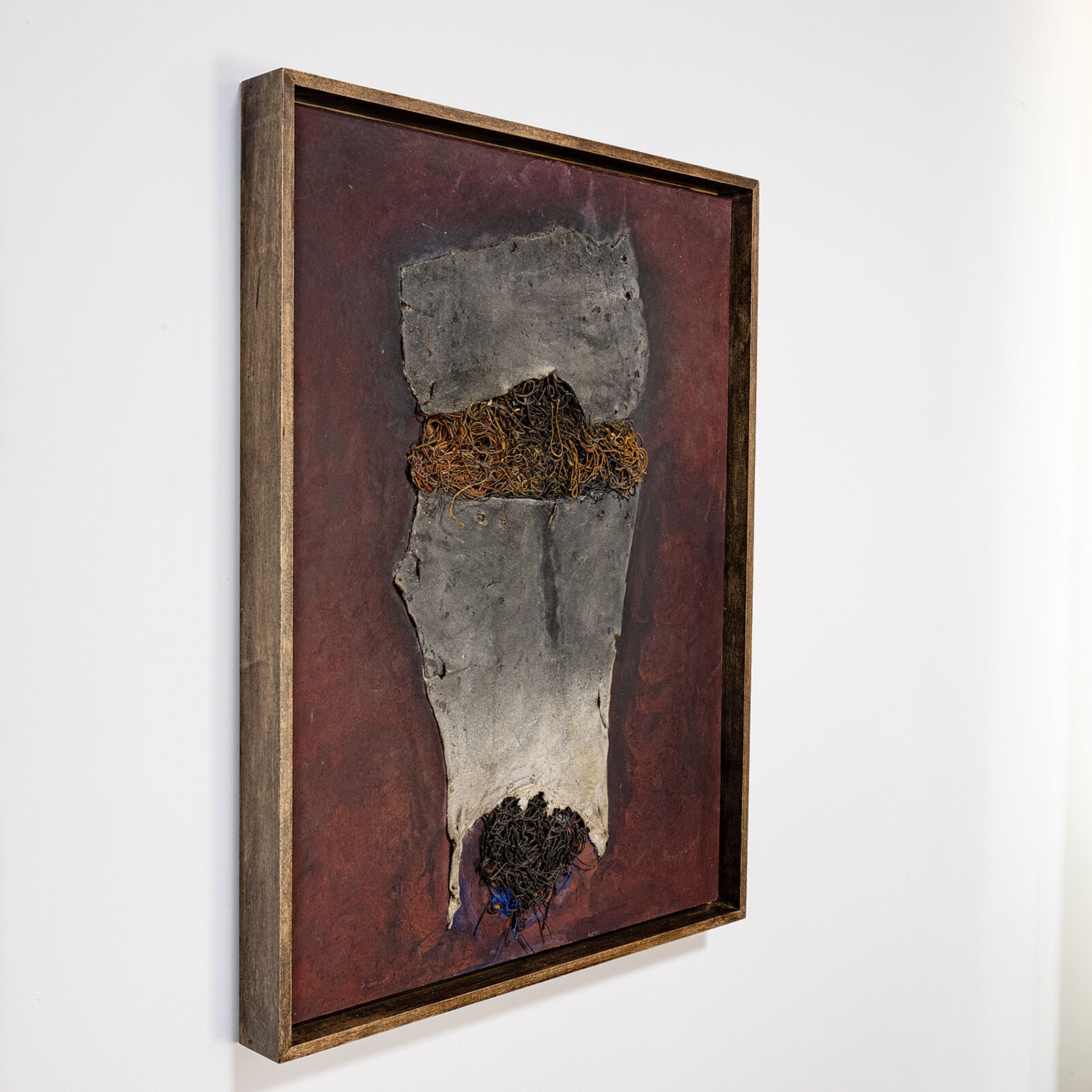 A painting hanging on a wall in a room.