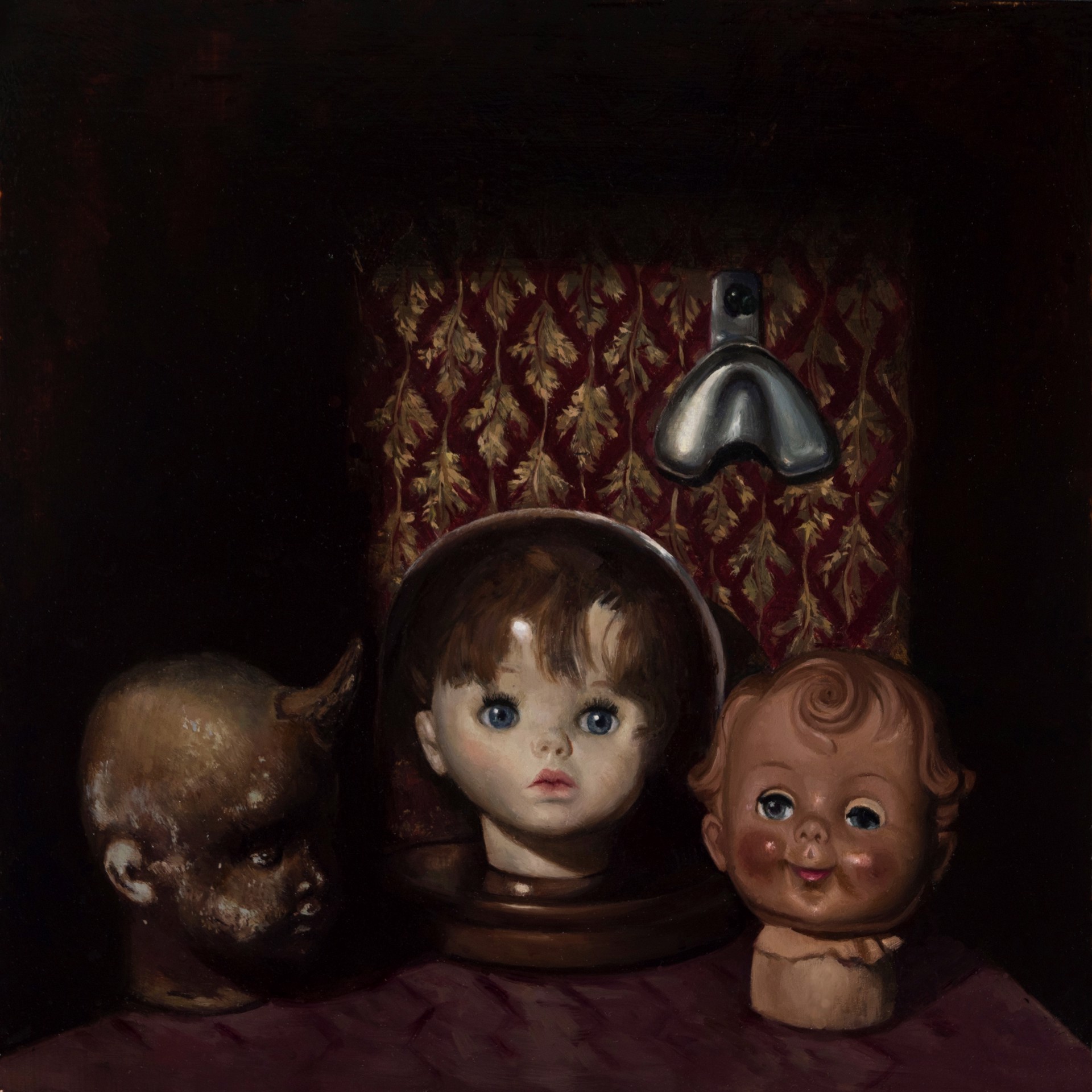 A painting of three dolls sitting on top of a table.
