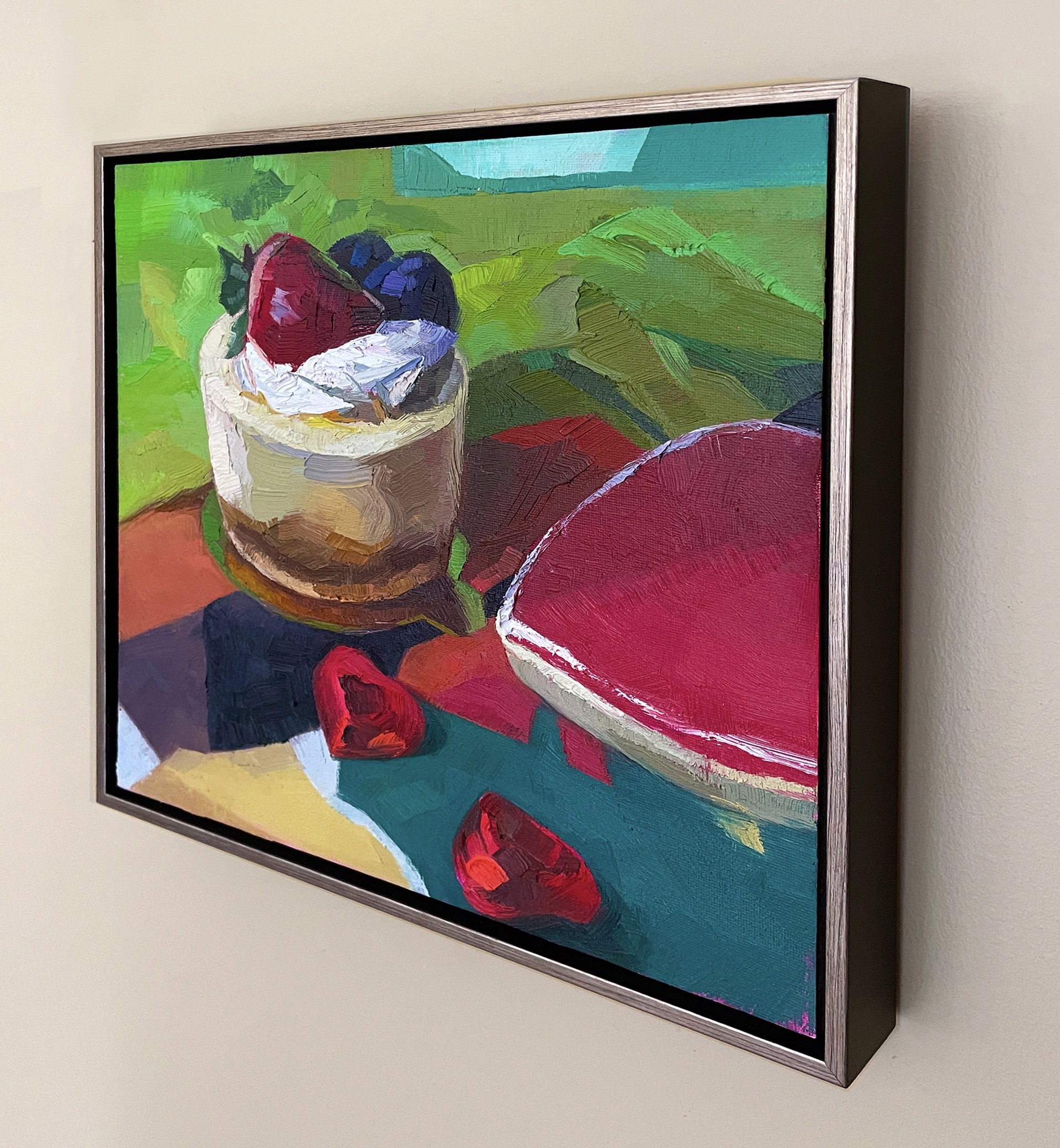 A painting of a dessert on a table with strawberries and blueberries.