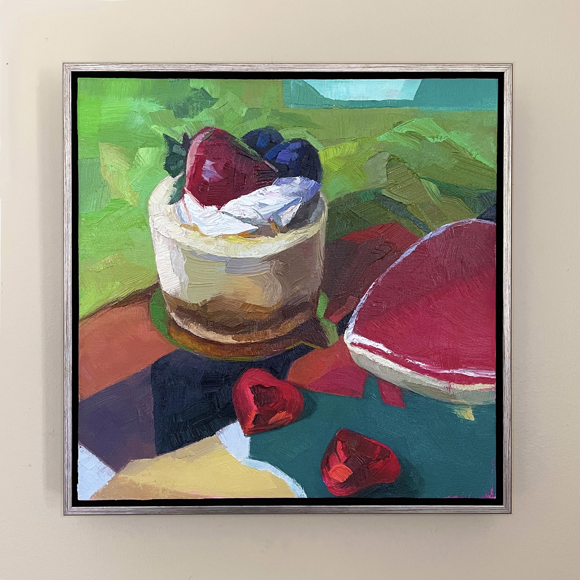 A painting of a dessert on a table with strawberries and blueberries.