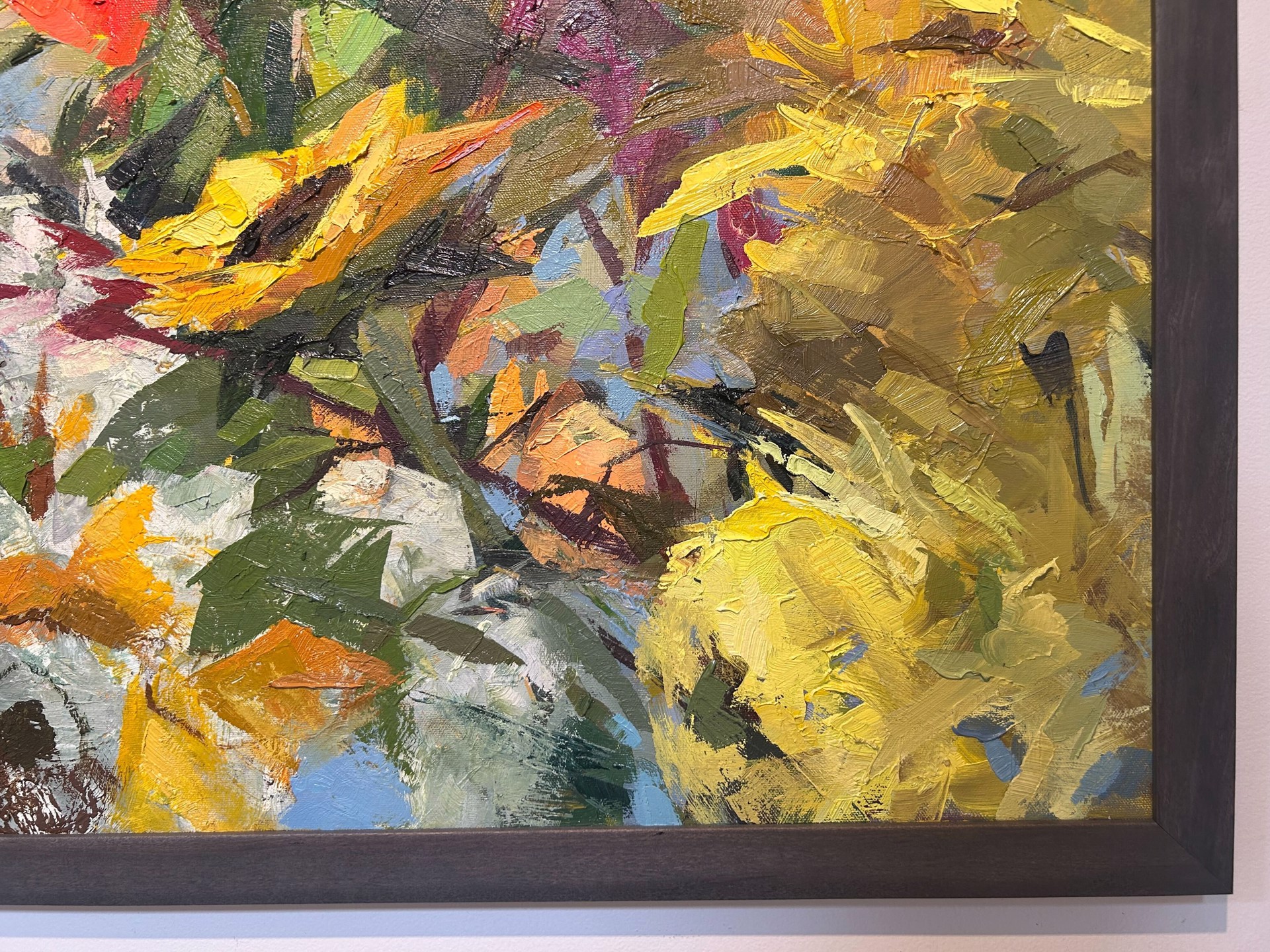 A painting of flowers in a vase on a table.