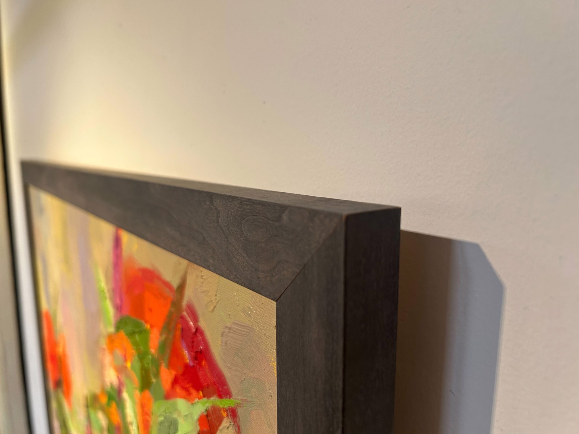 A painting of flowers in a vase on a table.