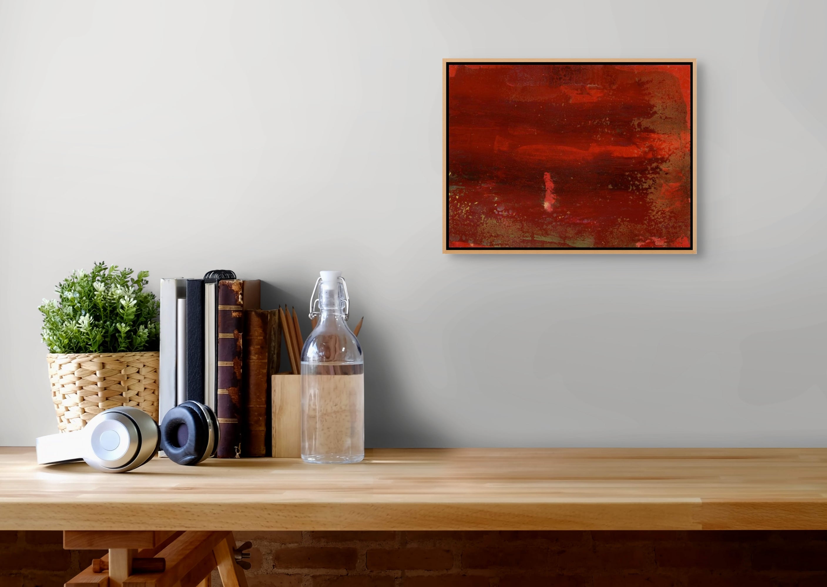 A red and gold painting on a white background.