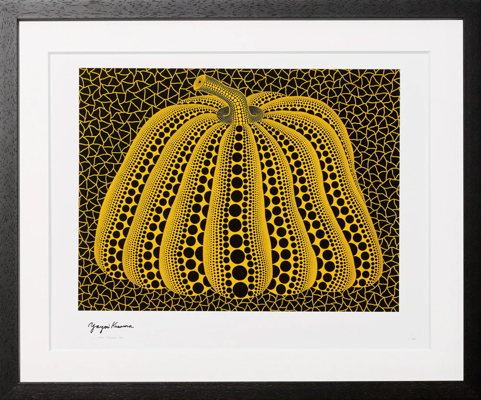 A black and yellow print of a pumpkin on a black background.