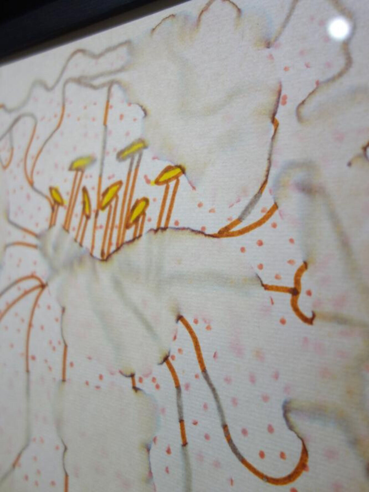 A picture of a painting hanging on a wall.