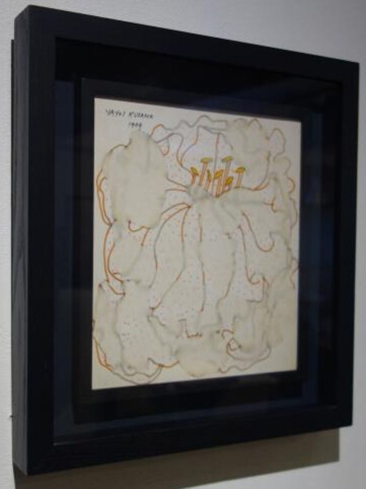 A picture of a painting hanging on a wall.