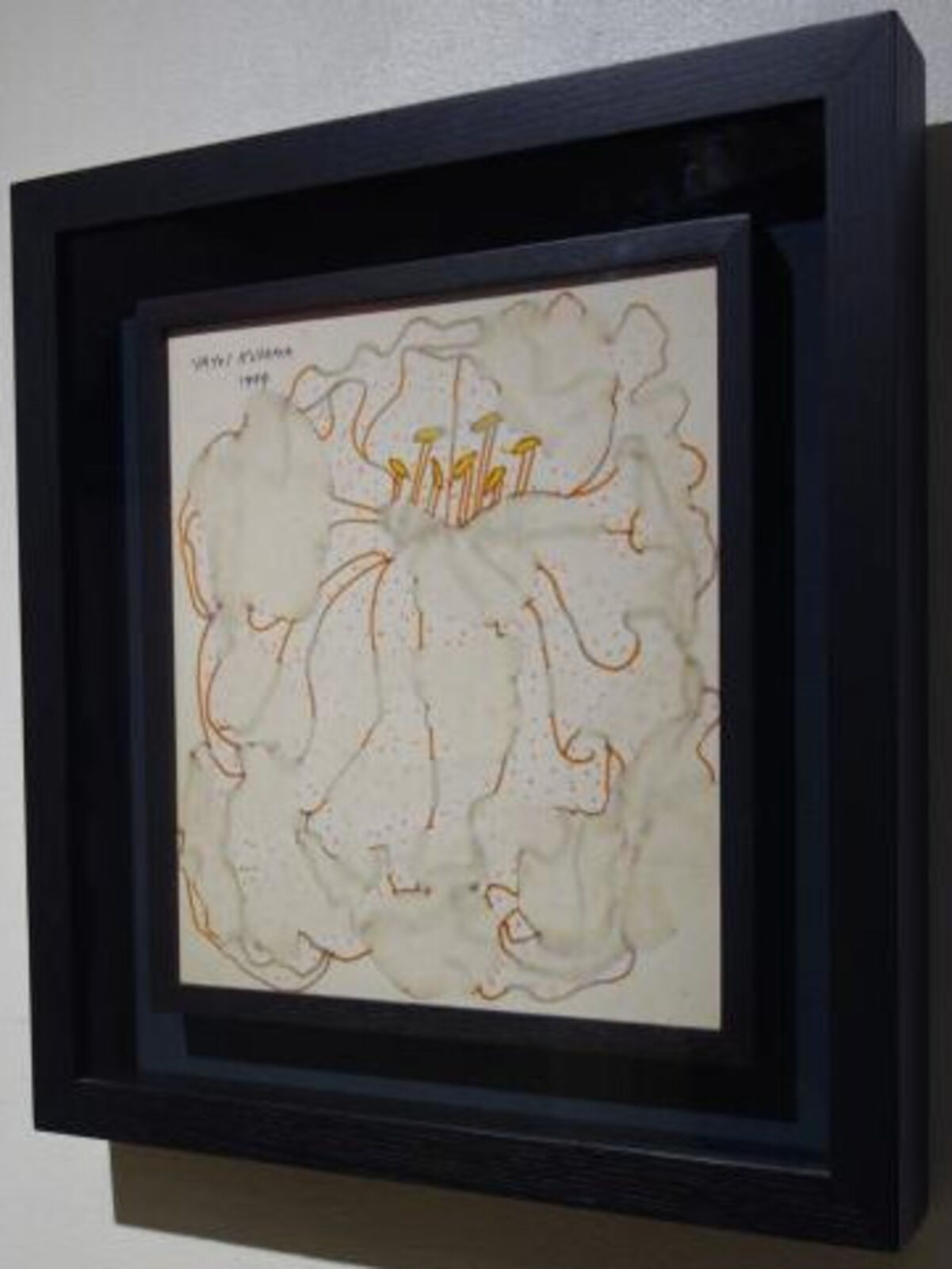 A picture of a painting hanging on a wall.