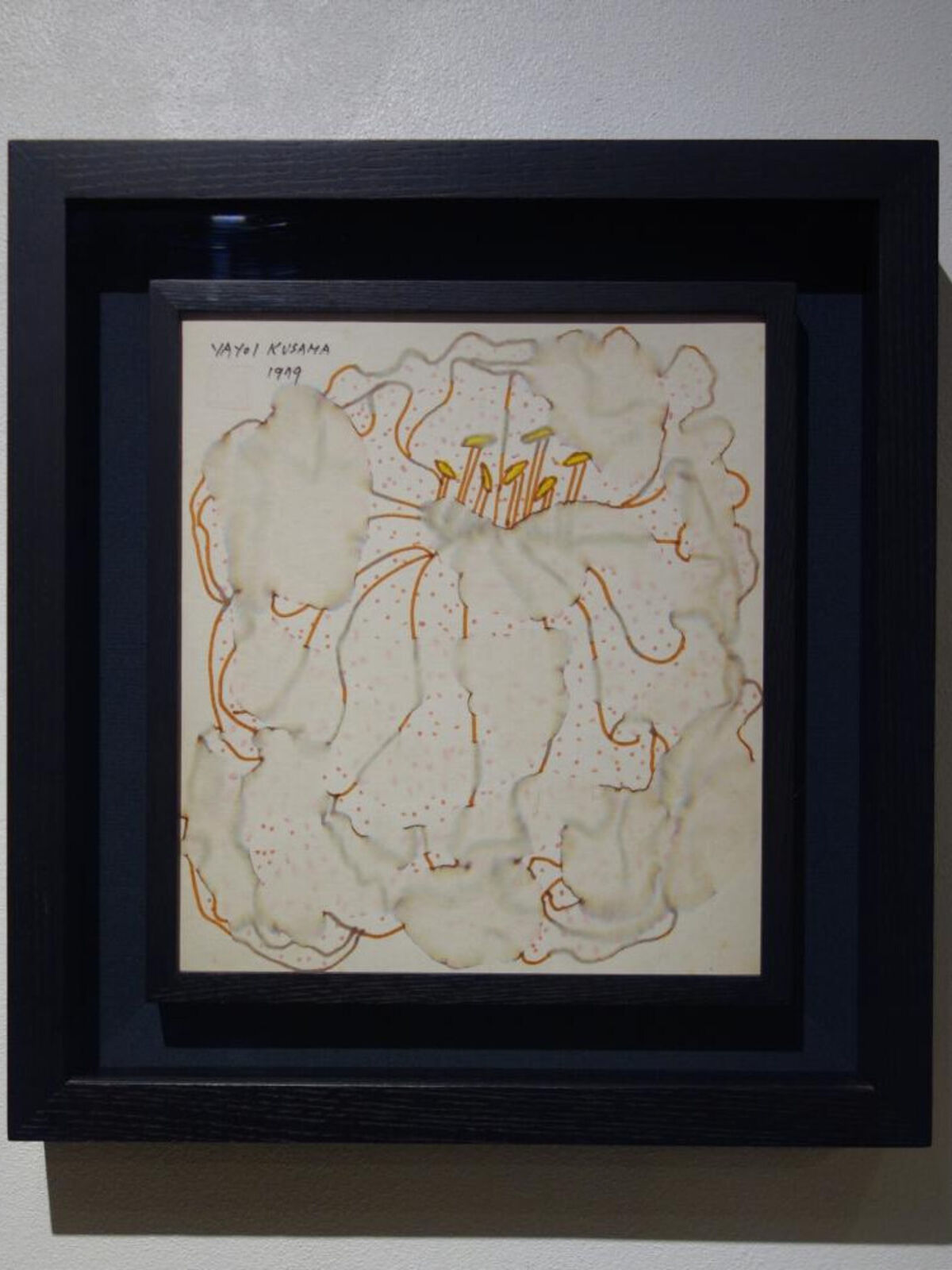 A picture of a painting hanging on a wall.