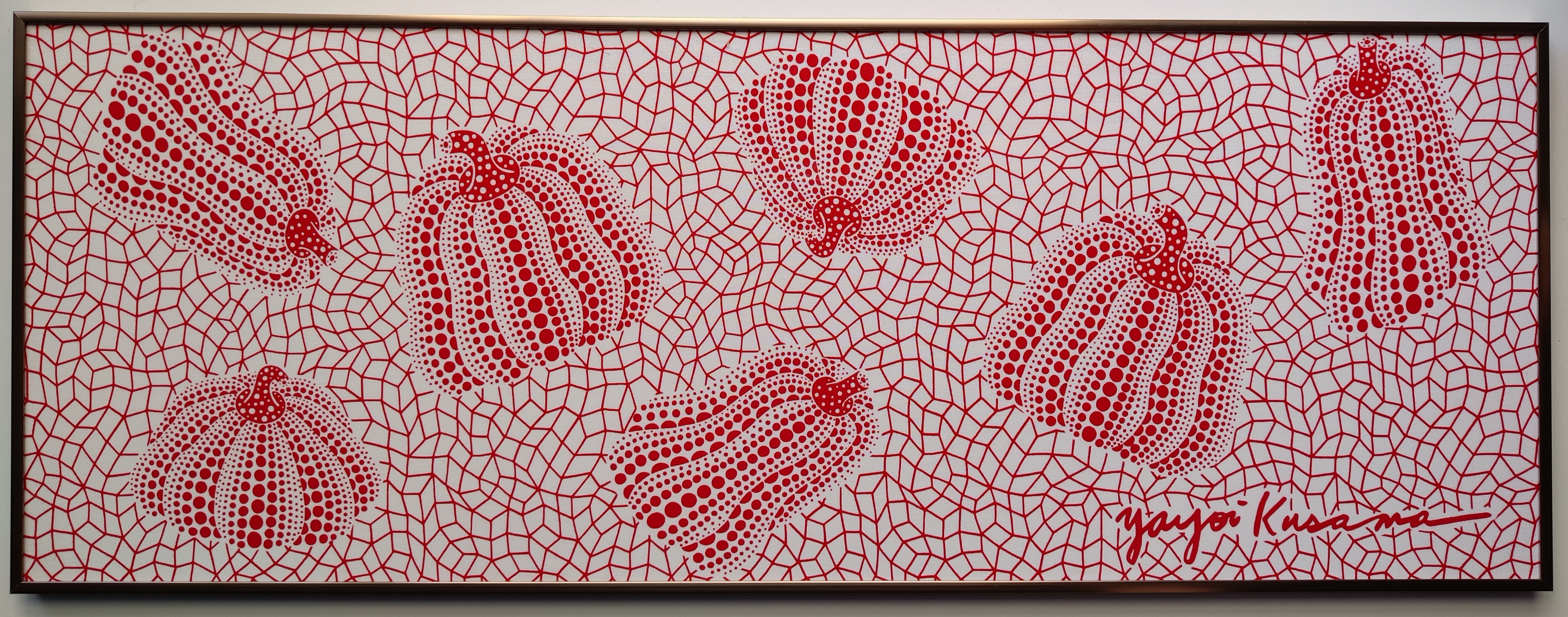 A red and white painting on a white wall.