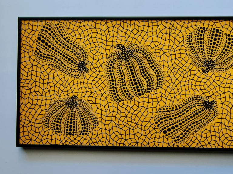 a painting on a wall with a black frame