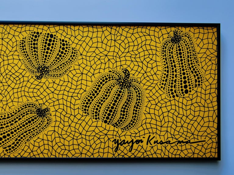 a painting on a wall with a black frame