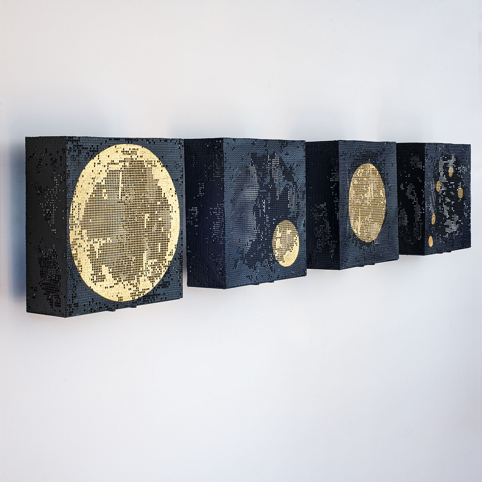 A set of four square canvases featuring pixelated celestial bodies against a minimalist interior.