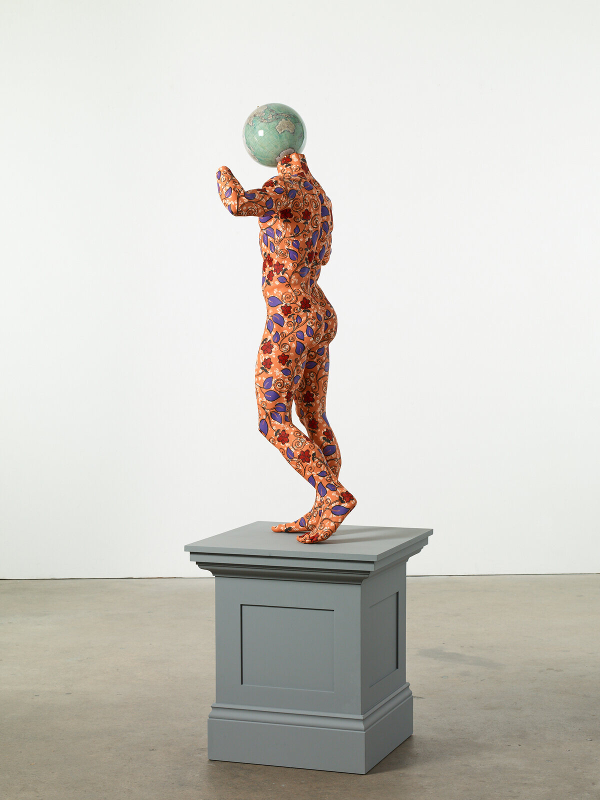 Artwork by Yinka Shonibare, Diadumenos, Made of Fibreglass sculpture, hand-painted with Dutch wax pattern, bespoke hand-coloured globe, gold leaf and steel base plate 