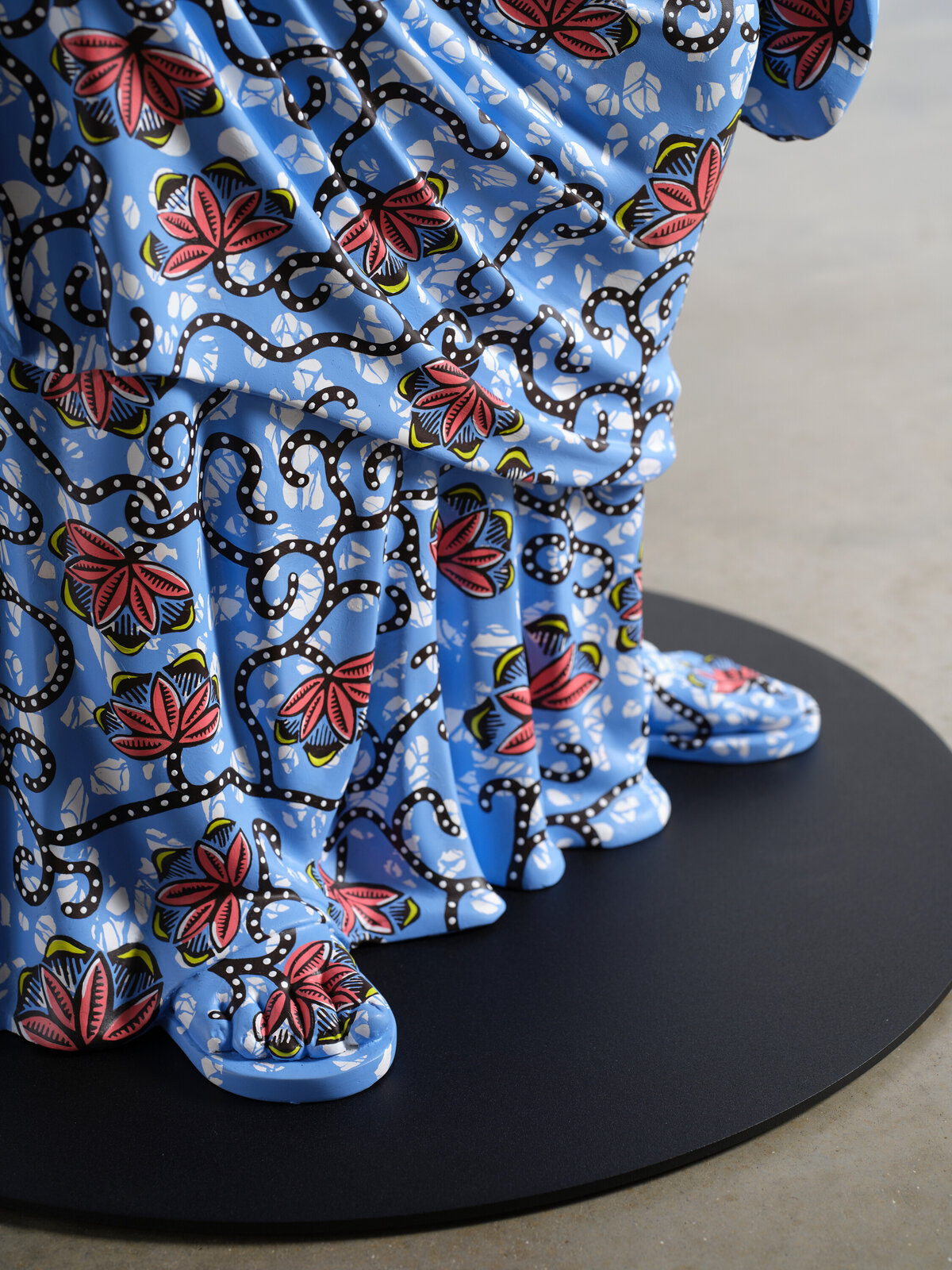 Artwork by Yinka Shonibare, Hybrid Sculpture (Terpsichore / Bété-Guro Mask), Made of Fibreglass sculpture, hand-painted with Dutch wax pattern, hand-carved wooden mask and steel baseplate or plinth 