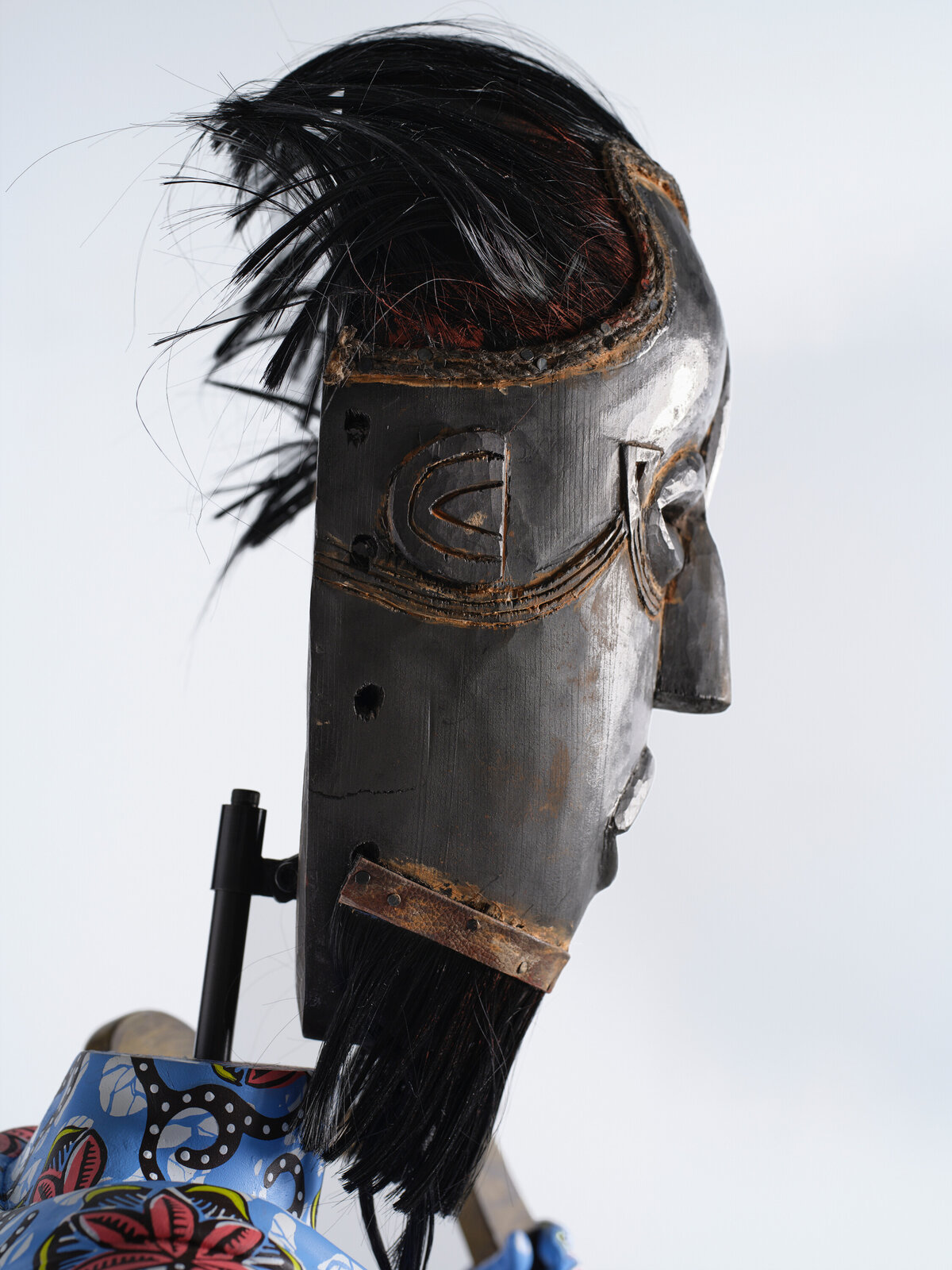 Artwork by Yinka Shonibare, Hybrid Sculpture (Terpsichore / Bété-Guro Mask), Made of Fibreglass sculpture, hand-painted with Dutch wax pattern, hand-carved wooden mask and steel baseplate or plinth 
