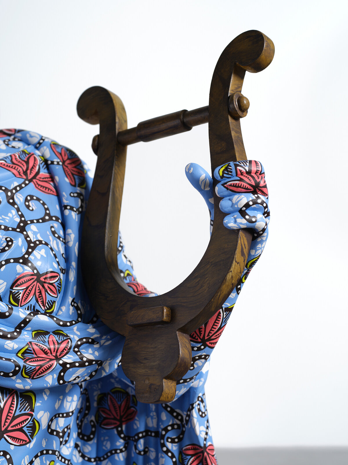 Artwork by Yinka Shonibare, Hybrid Sculpture (Terpsichore / Bété-Guro Mask), Made of Fibreglass sculpture, hand-painted with Dutch wax pattern, hand-carved wooden mask and steel baseplate or plinth 