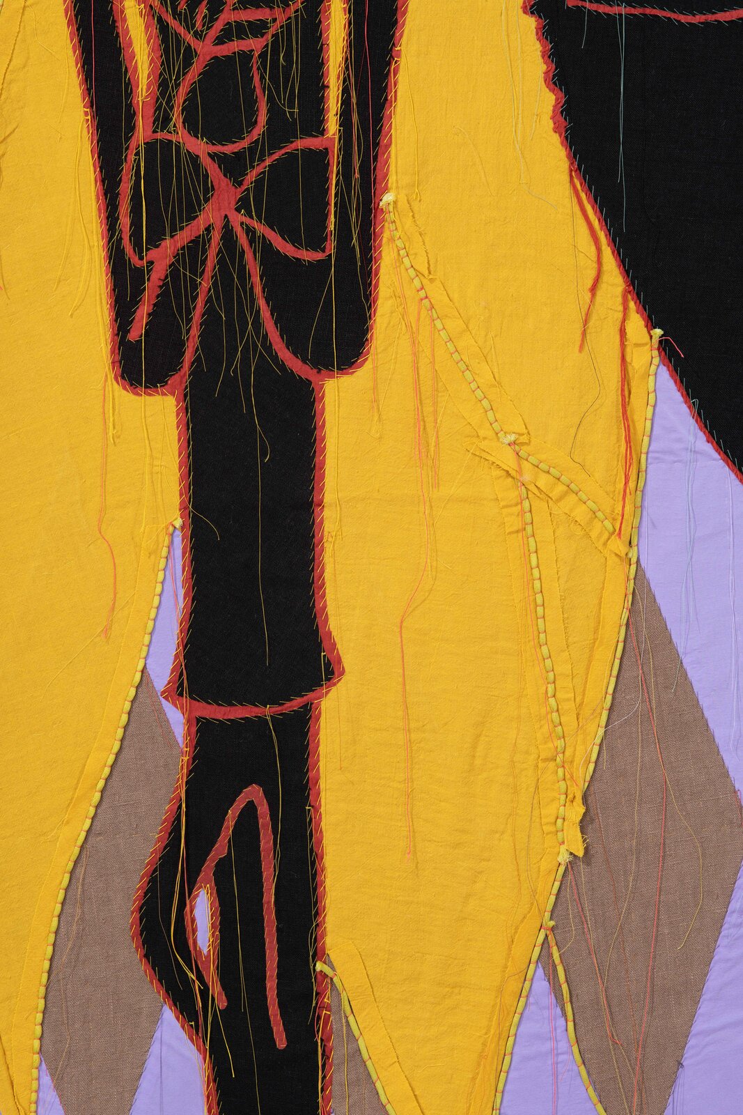 A painting of three masks on a yellow background.