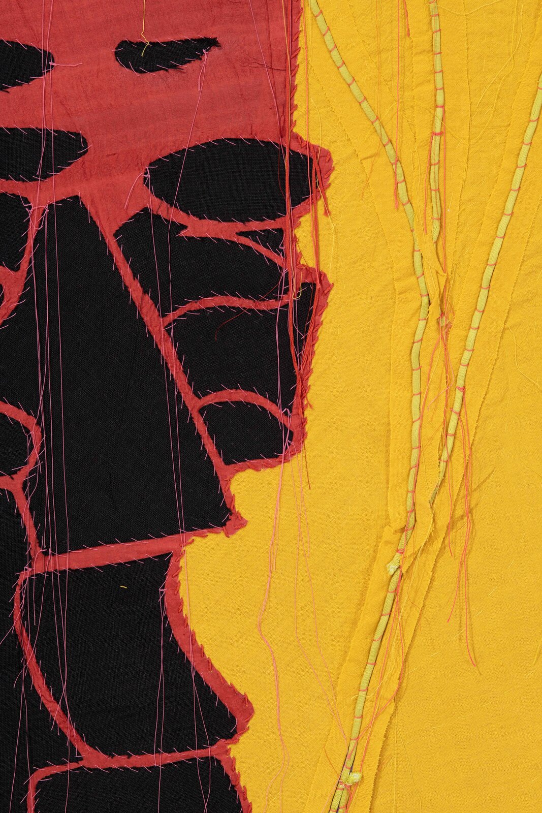 A painting of three masks on a yellow background.