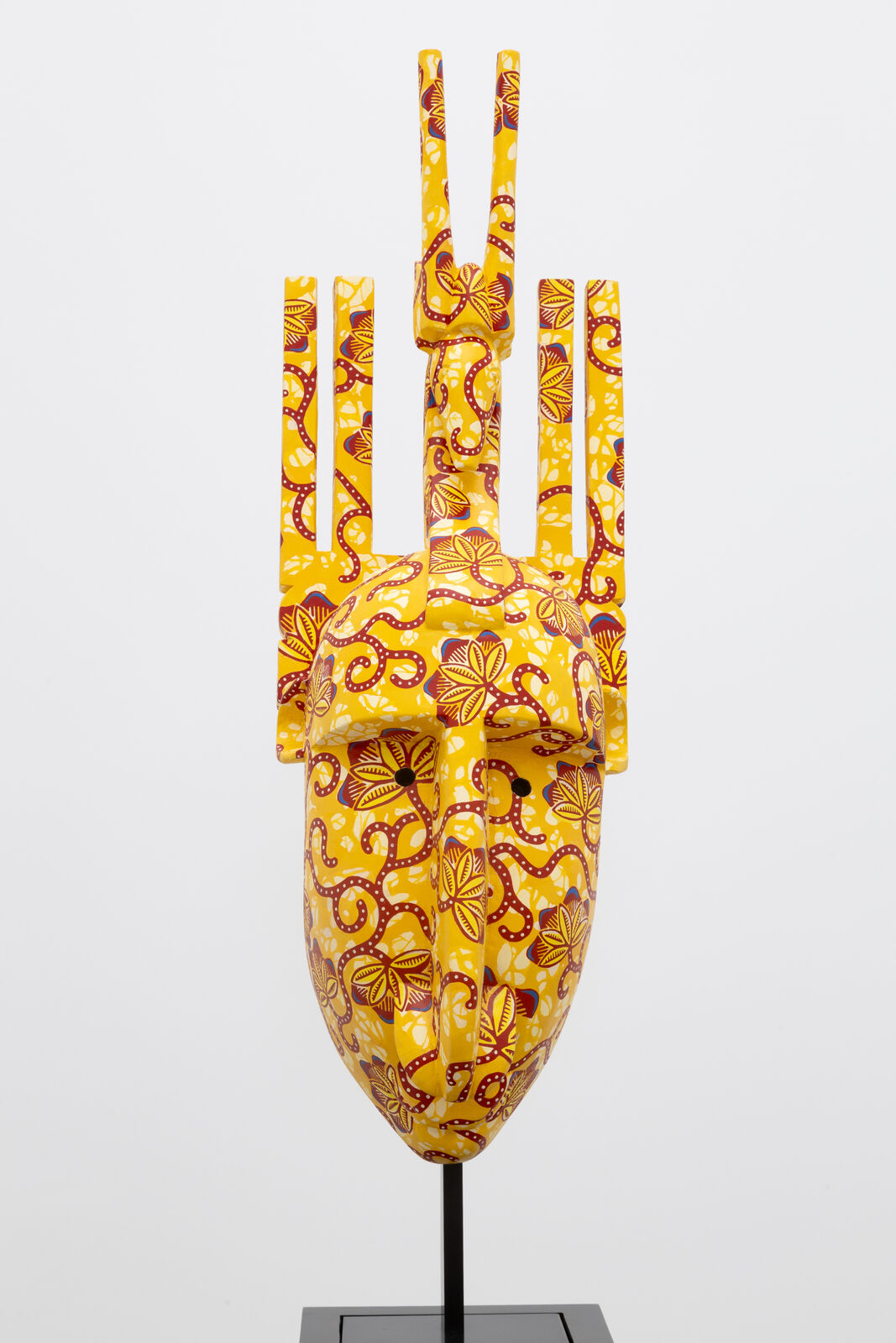 Artwork by Yinka Shonibare, Hybrid Mask (Bamana N Ntomo), Made of Wood, acrylic paint, and brass 