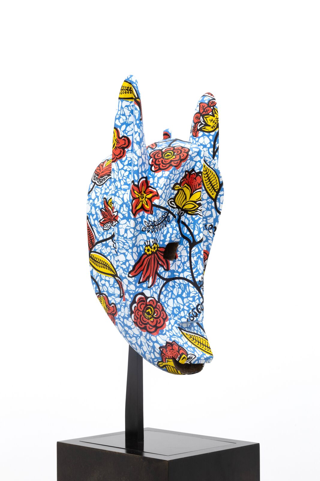 Artwork by Yinka Shonibare, Hybrid Mask (Koré) II, Made of Wood, acrylic paint, and brass 