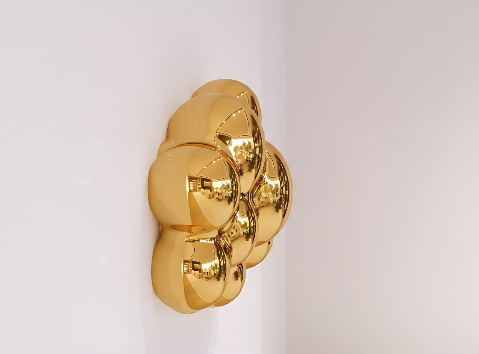 A gold plate with a reflection of a building in it.