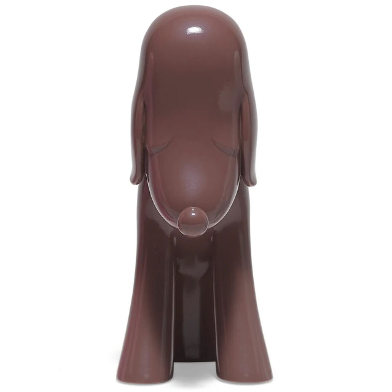 A brown dog figurine sitting on a white background.