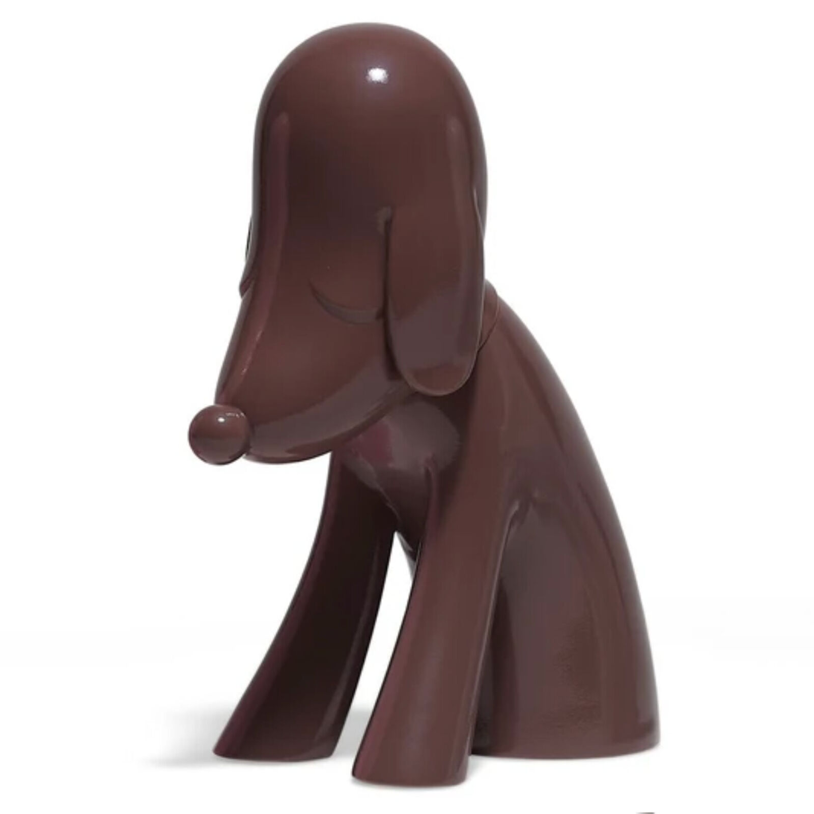 A brown dog figurine sitting on a white background.