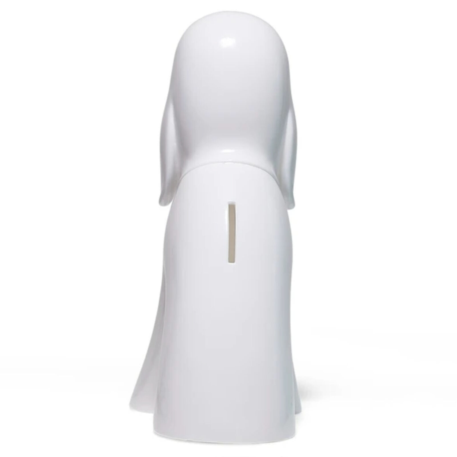 A white dog figurine sitting on a white surface.