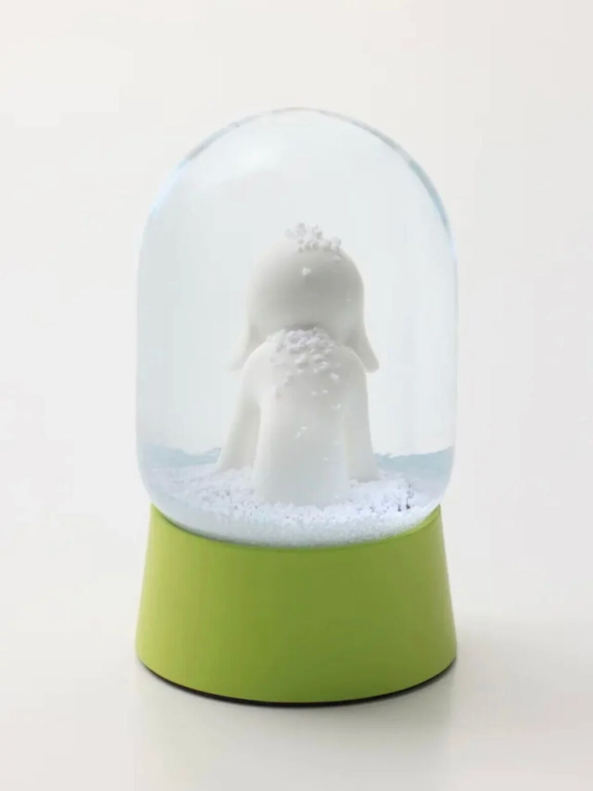 A snow globe with a polar bear inside of it.