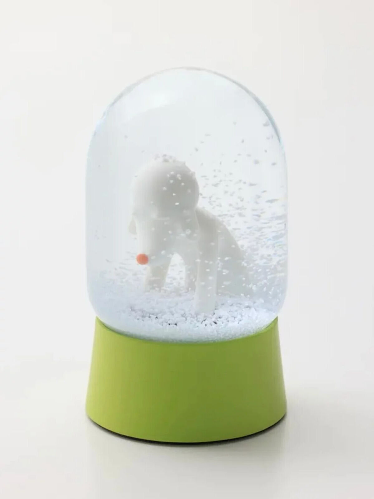 A snow globe with a polar bear inside of it.