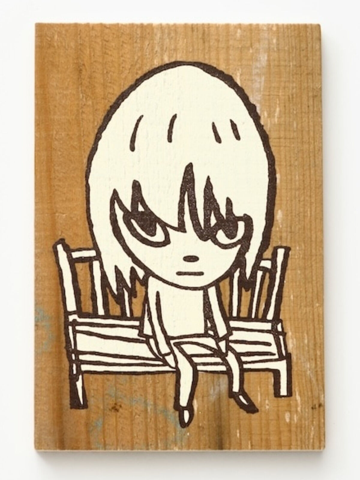 A drawing of a girl sitting on a bench.