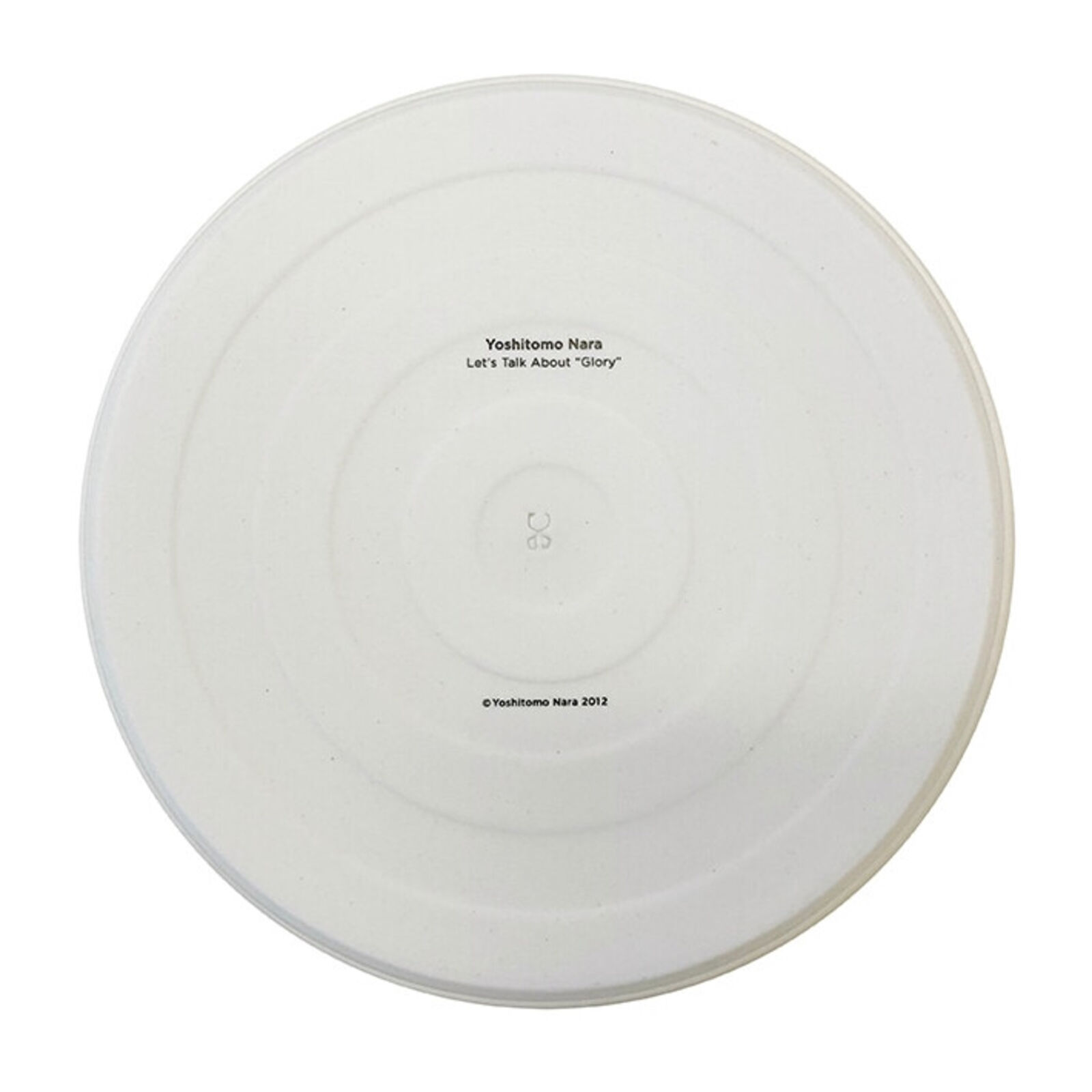 A plate with a drawing of a little girl sitting on the ground.