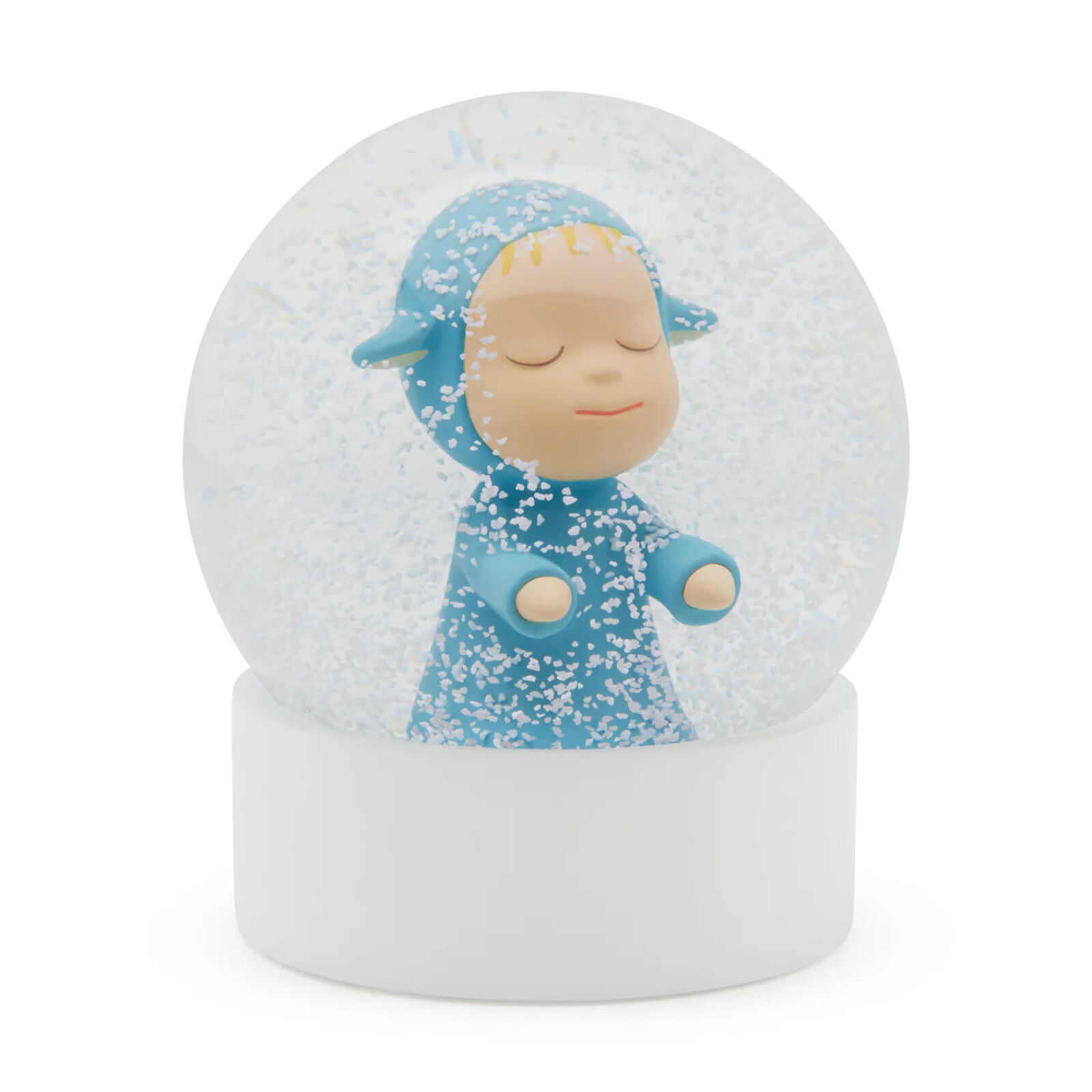 A snow globe with a little boy in a blue outfit.