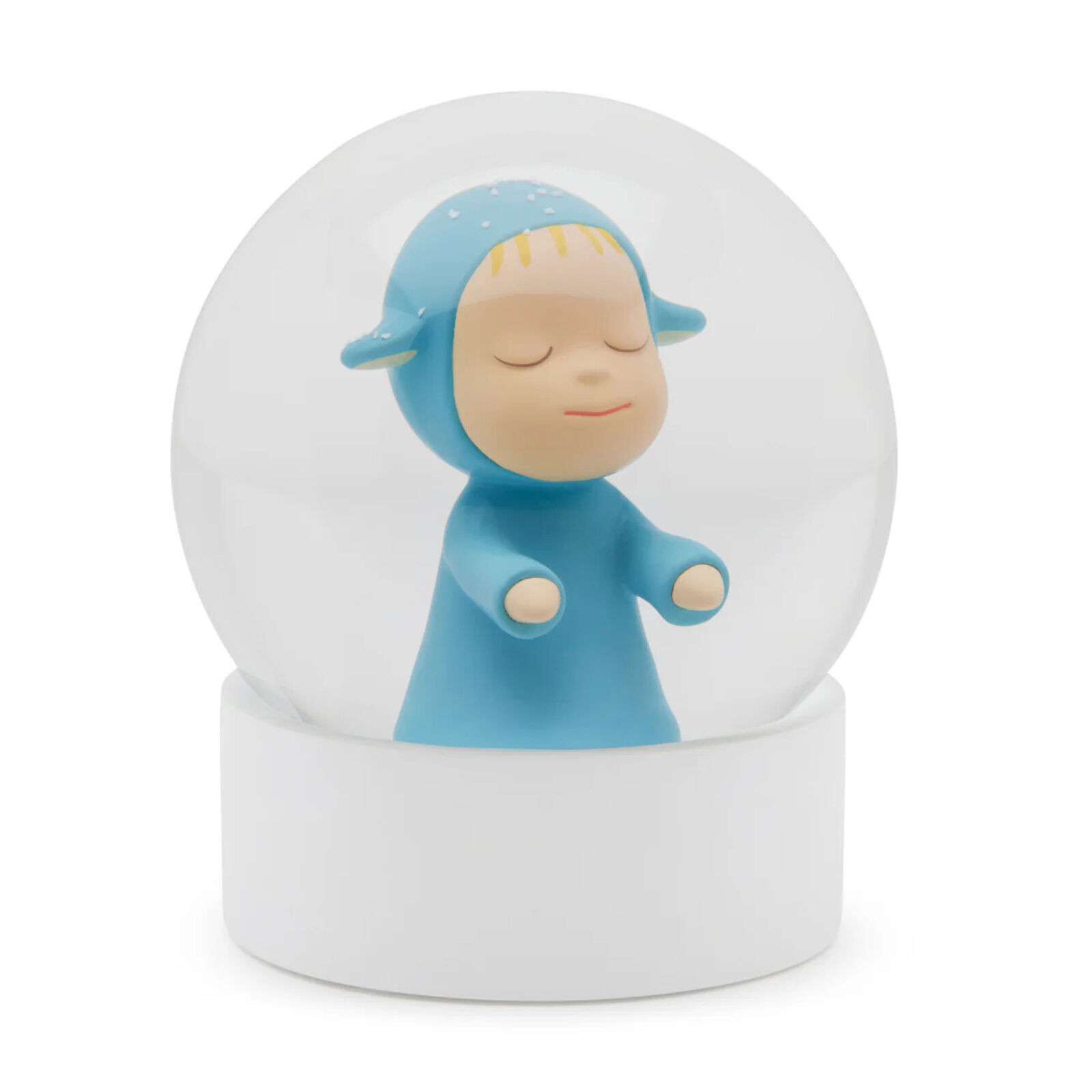 A snow globe with a little boy in a blue outfit.