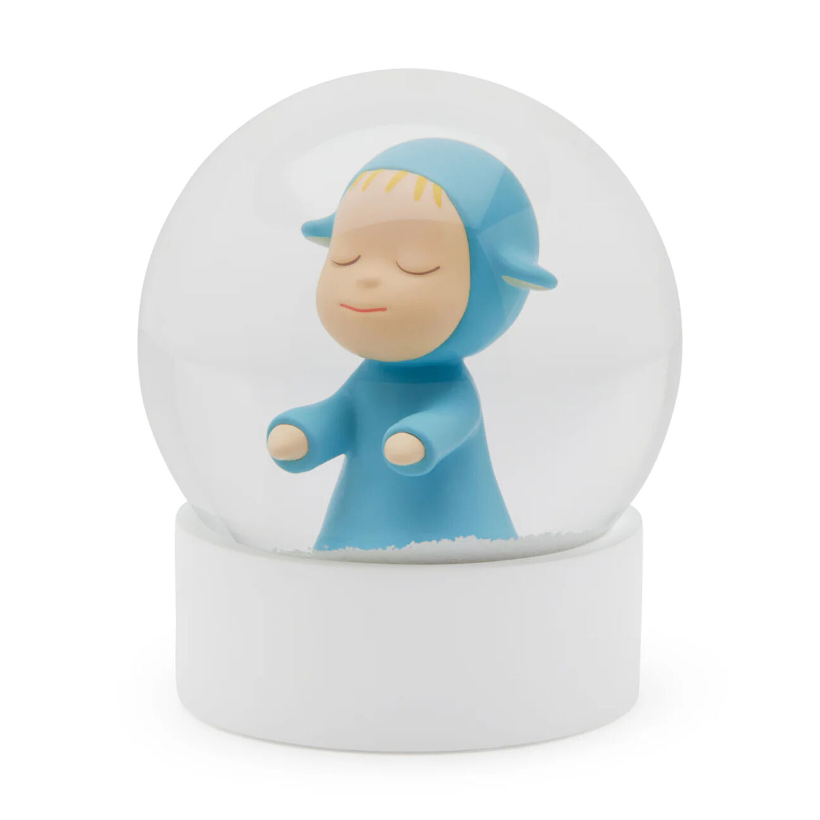 A snow globe with a little boy in a blue outfit.
