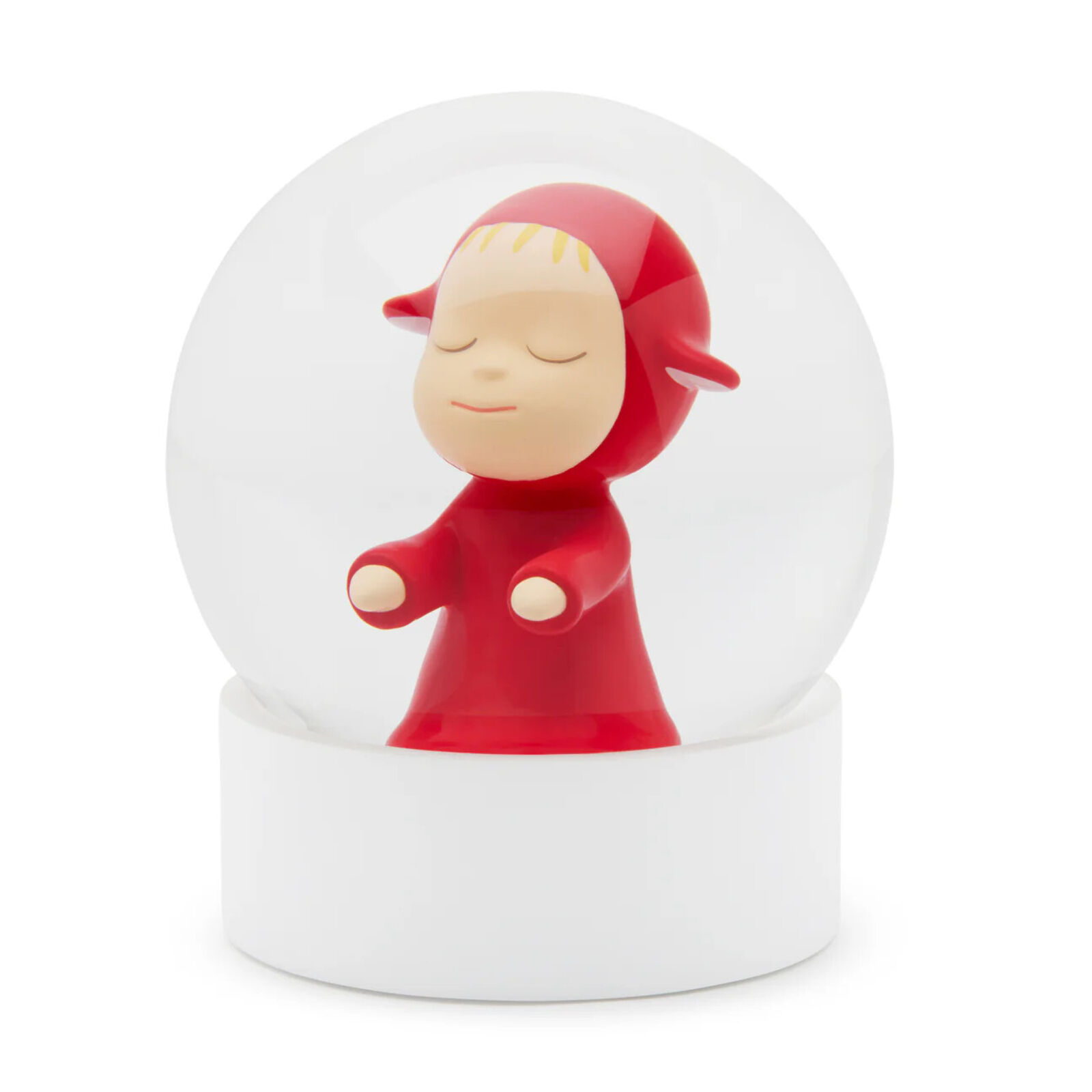 A snow globe with a little girl in a red dress.