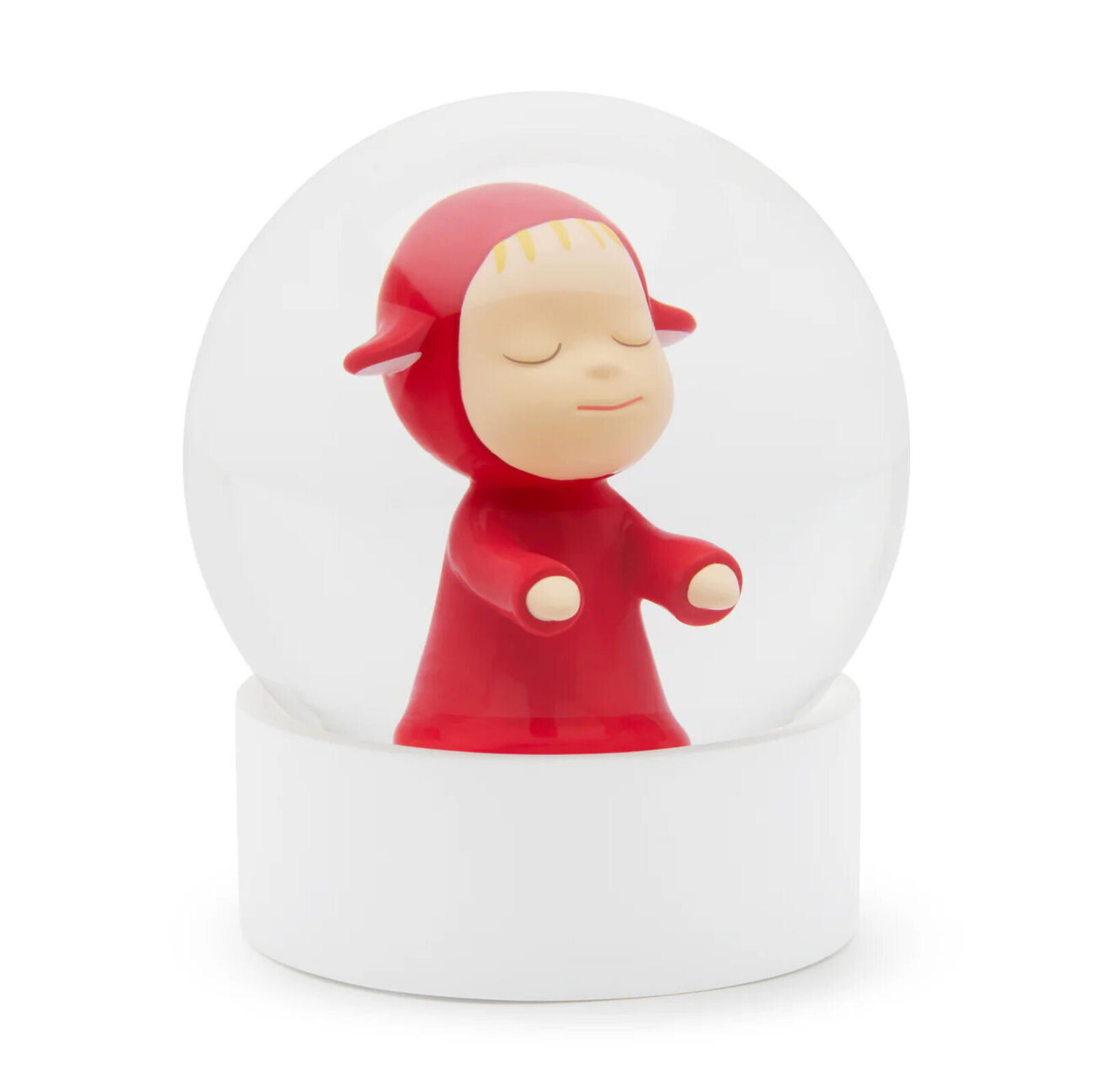 A snow globe with a little girl in a red dress.