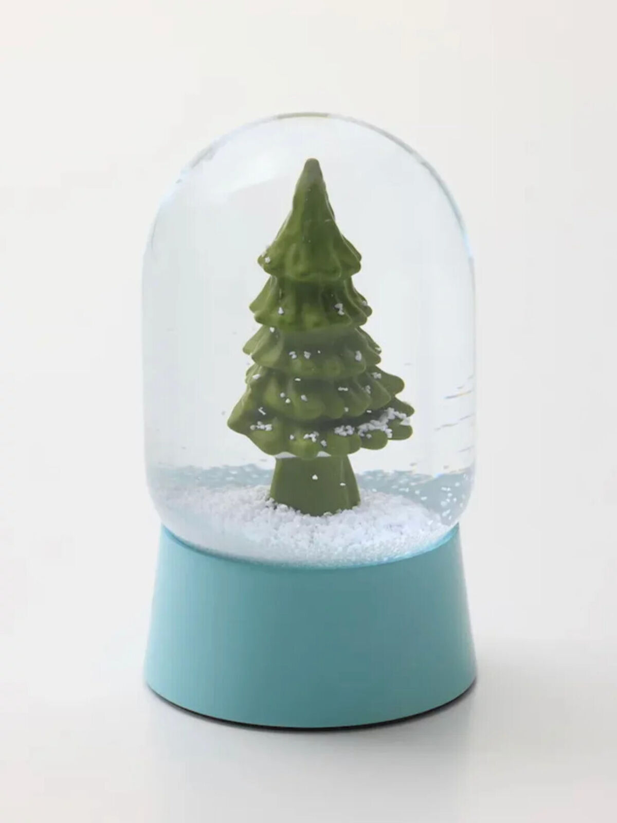 A snow globe with a small christmas tree inside of it.