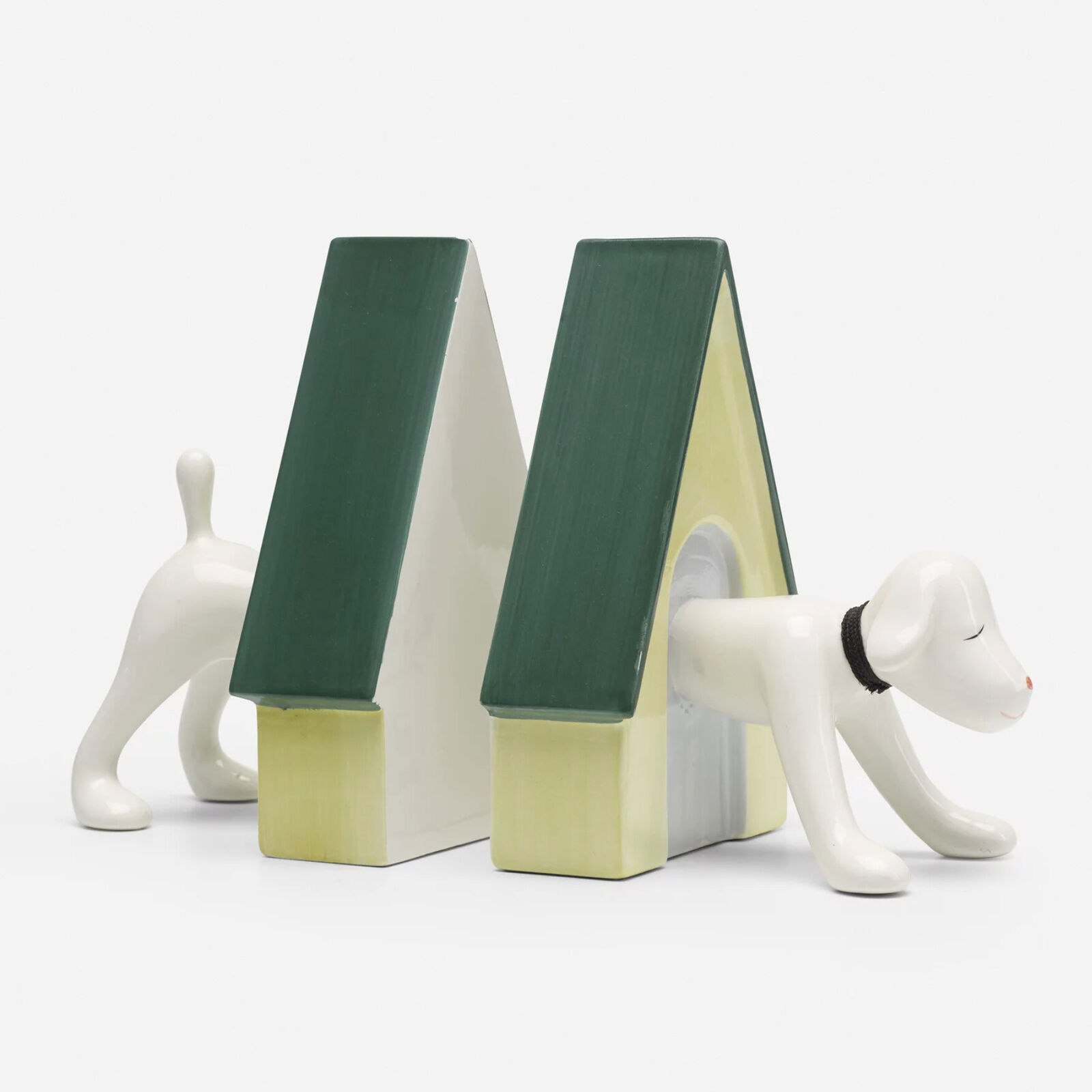 A pair of bookends with a dog and a doghouse.