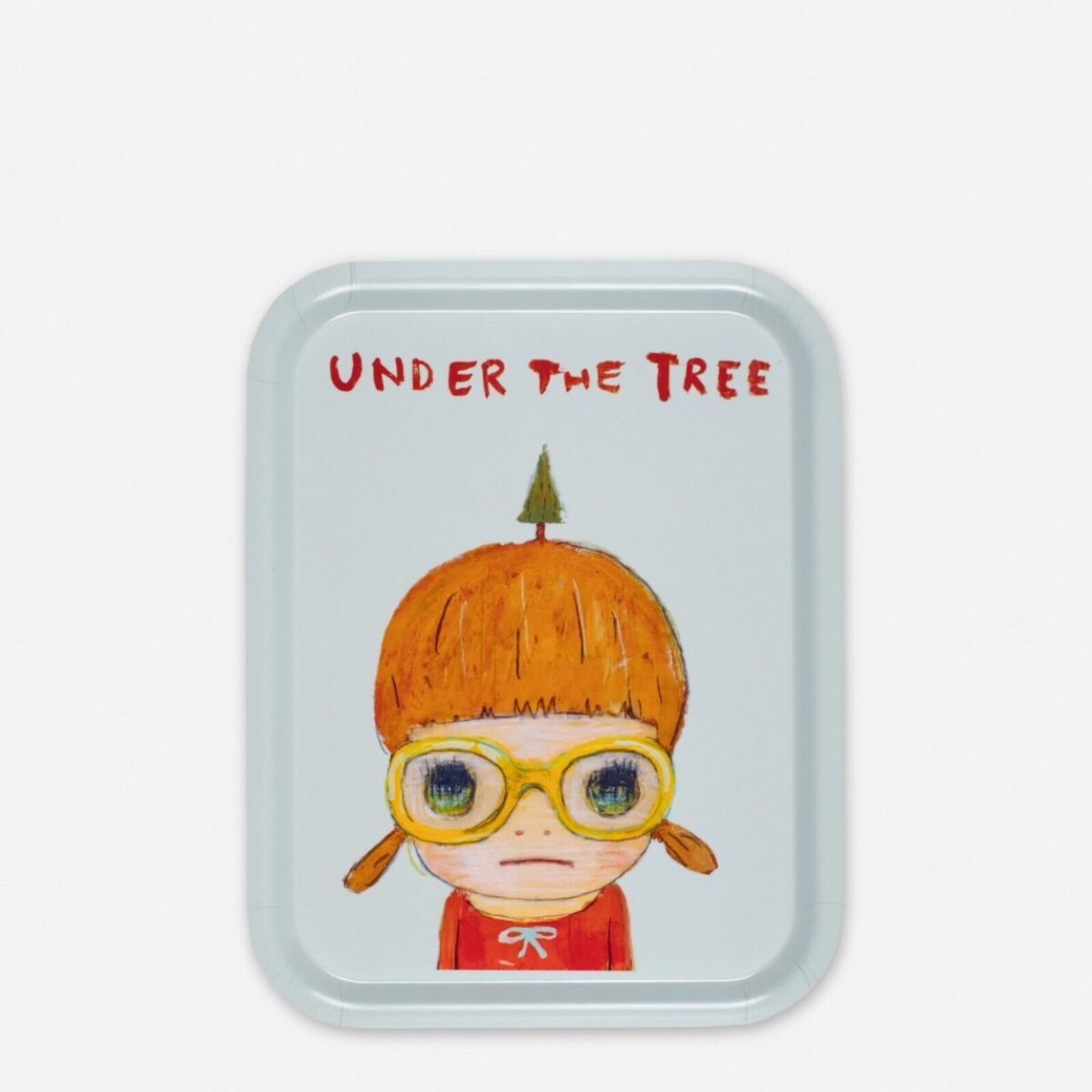 A small tray with a drawing of a little girl wearing glasses.