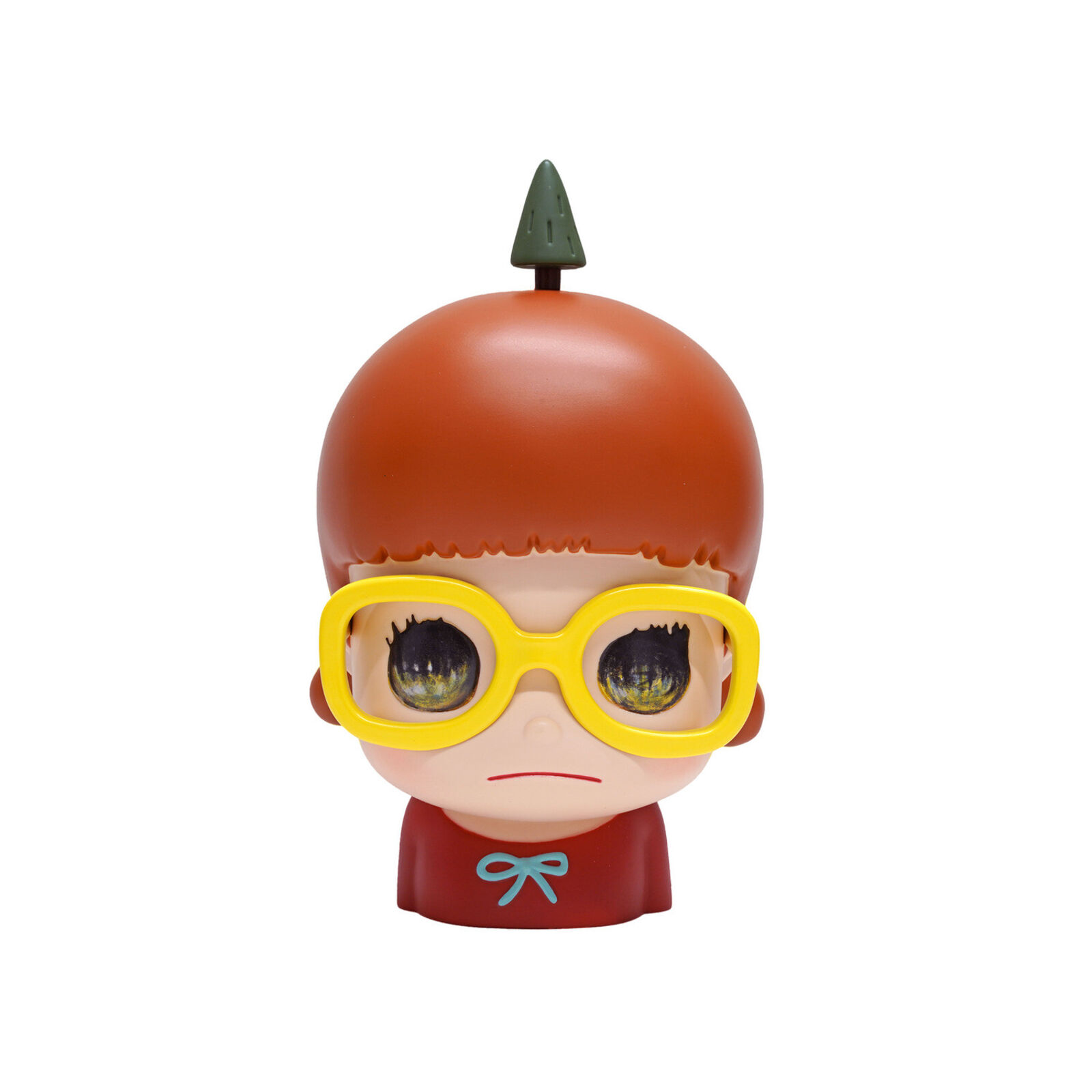 A small figurine of a boy wearing yellow glasses.