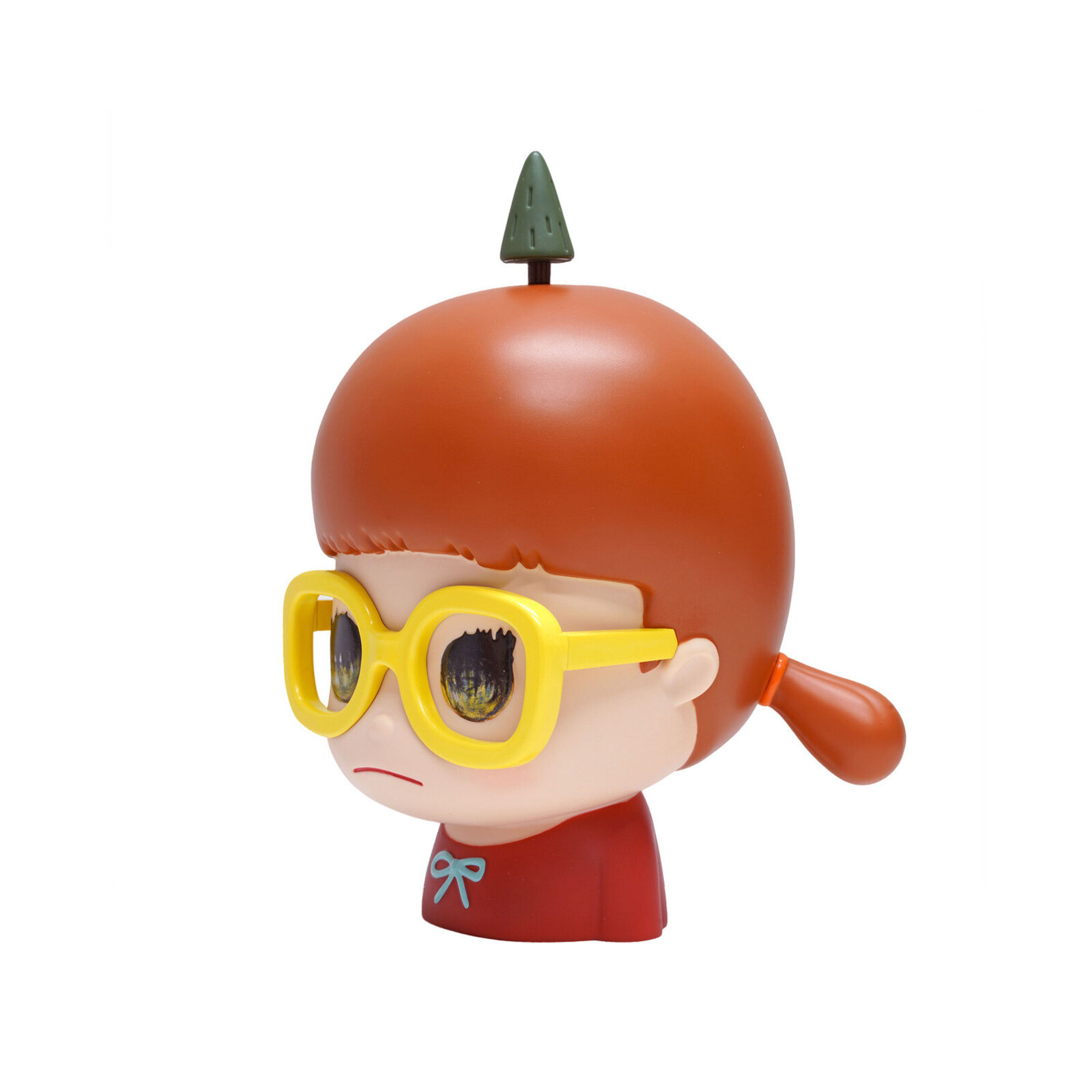 A small figurine of a boy wearing yellow glasses.