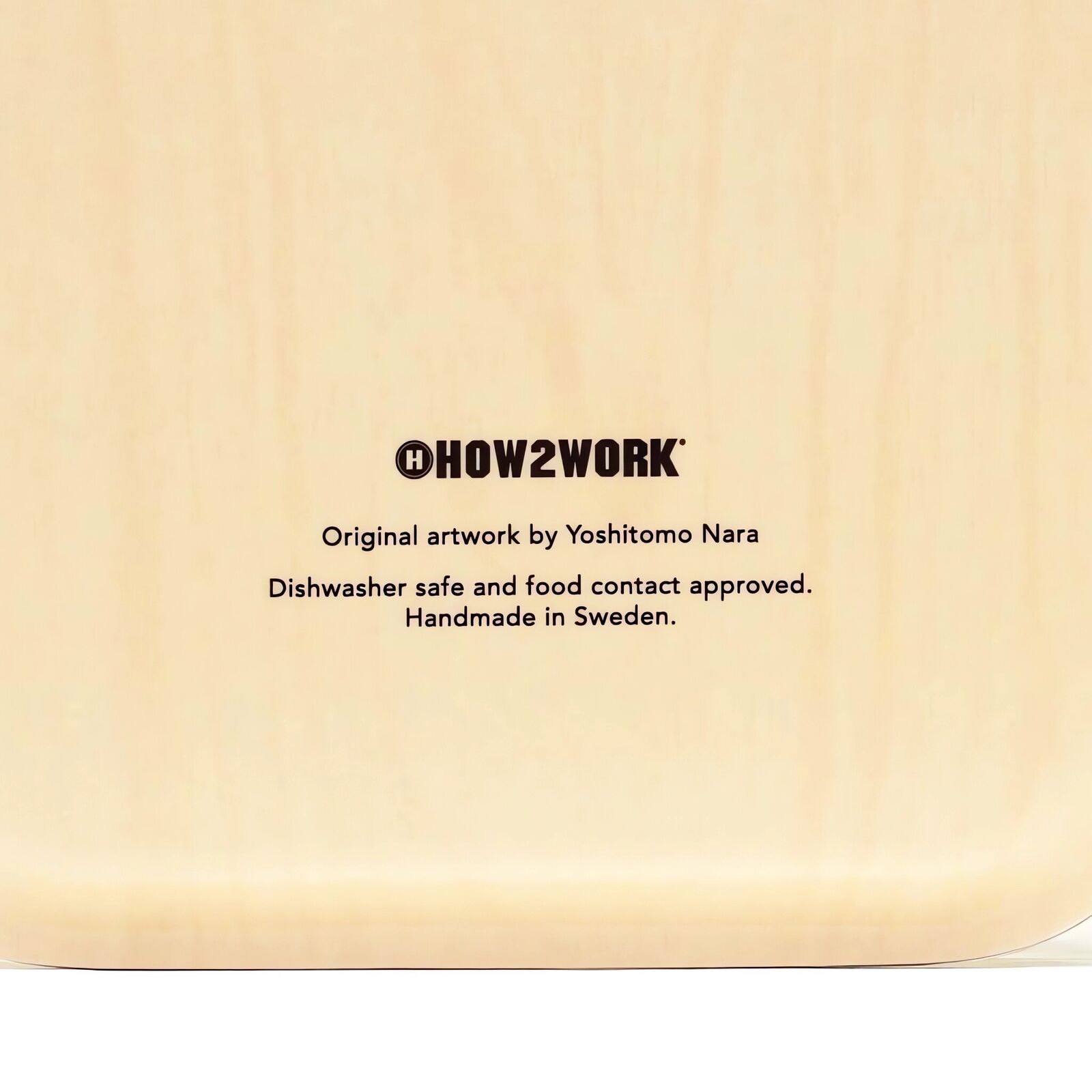 A small tray with a drawing of a boy's face on it.