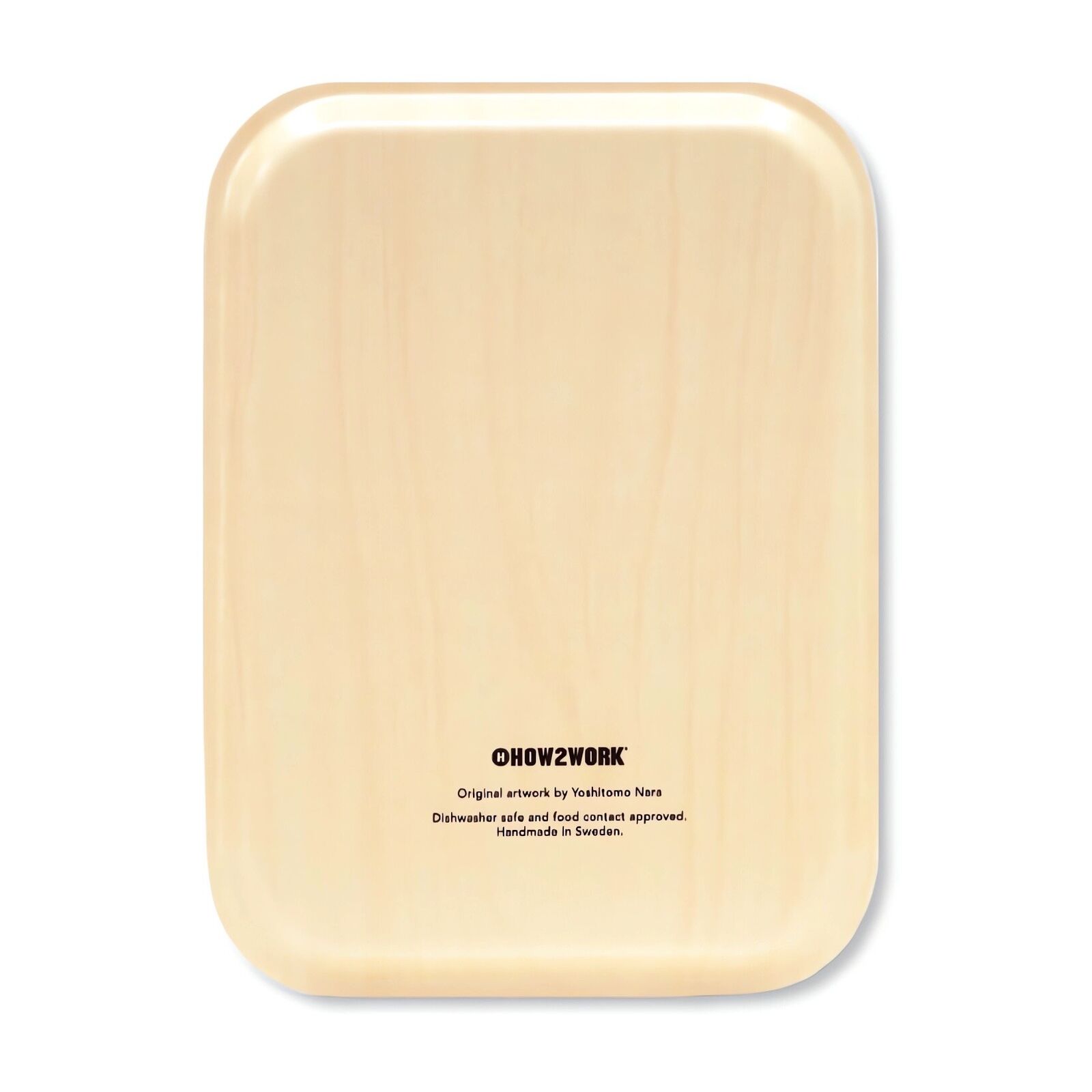 A small tray with a drawing of a boy's face on it.